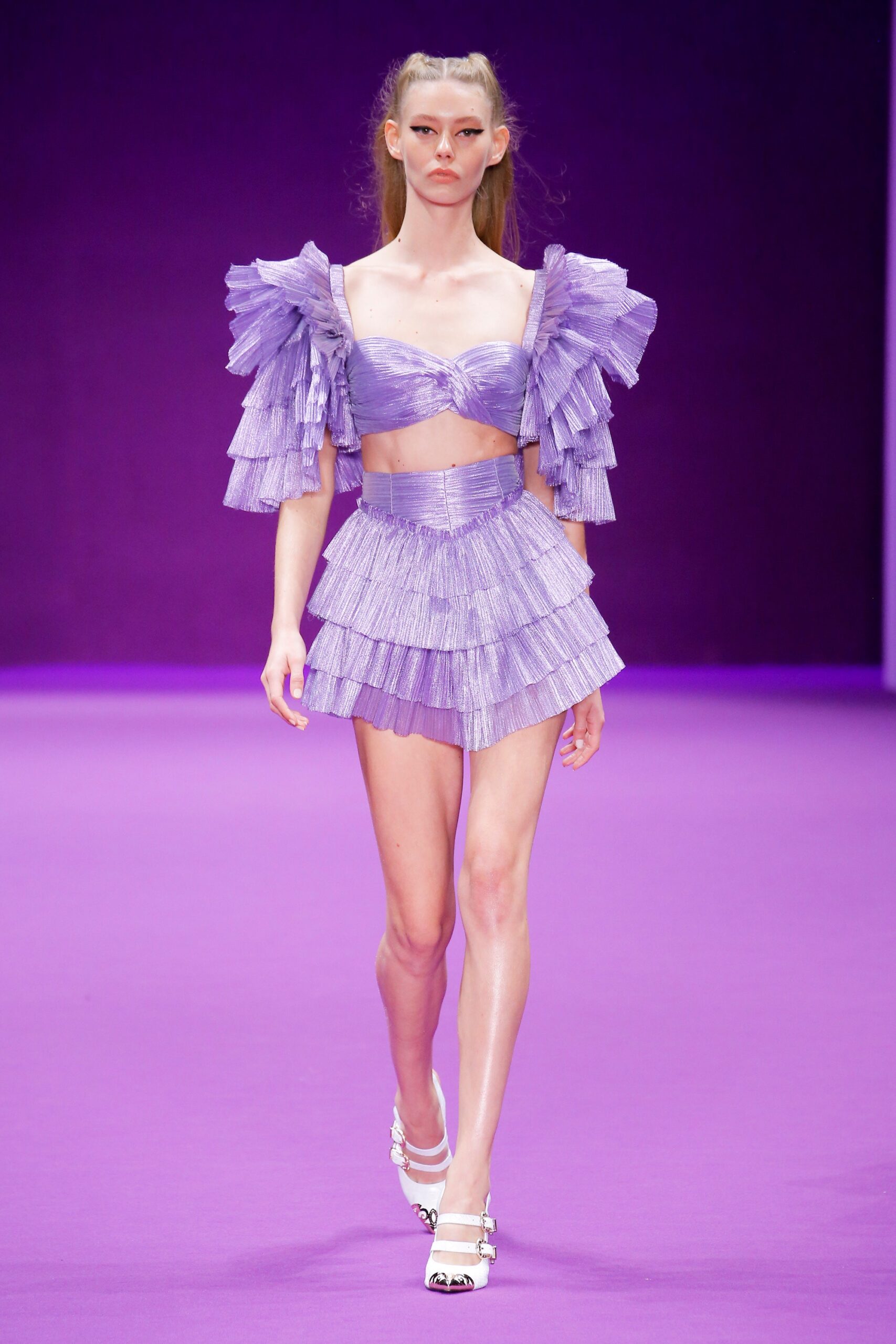 purple ruffled top and mini skirt