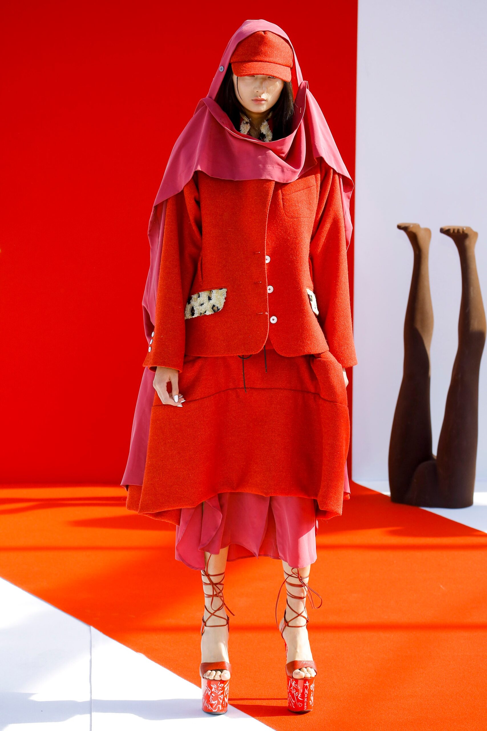 red wool coat and pink dress
