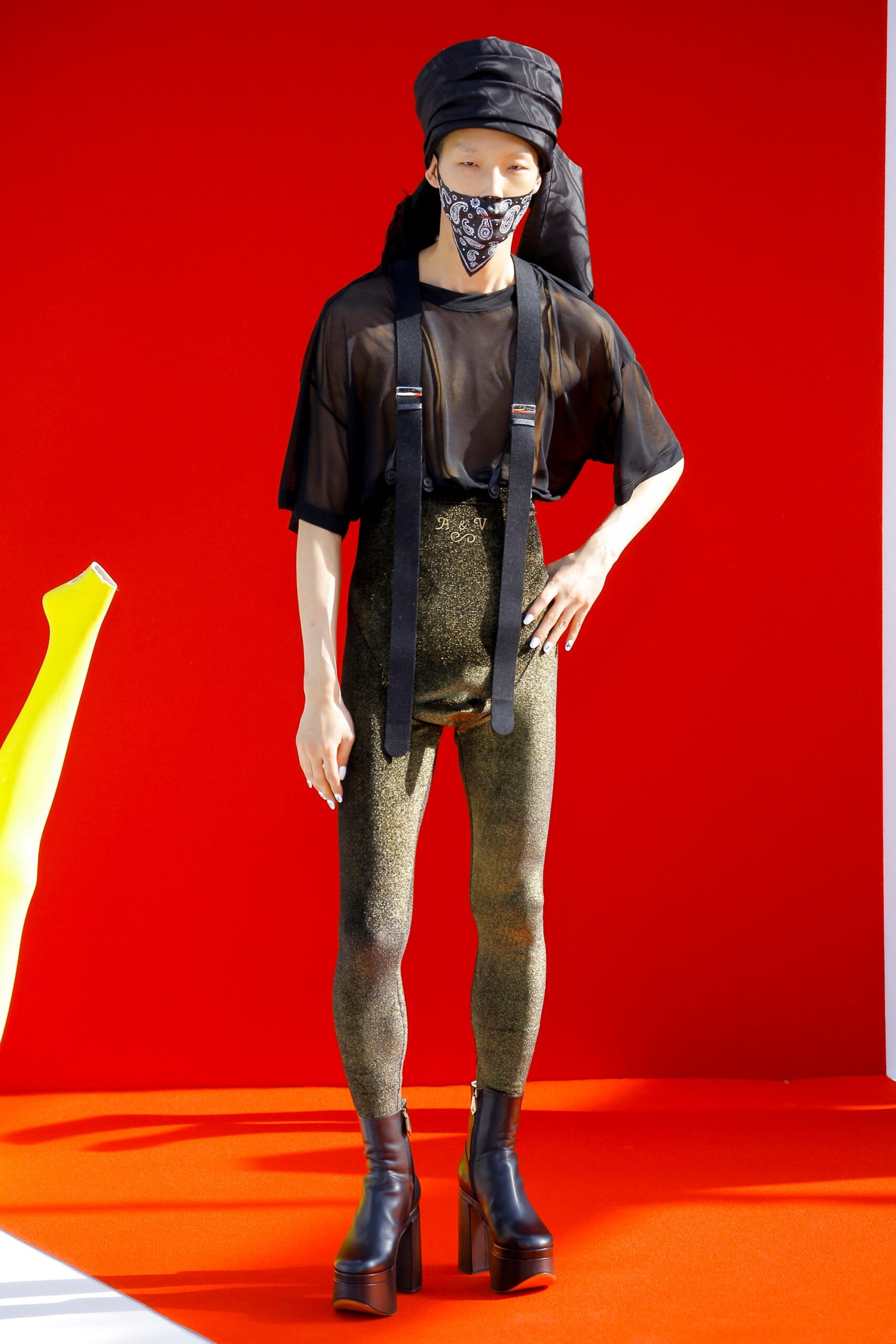 black mesh top with gold pants