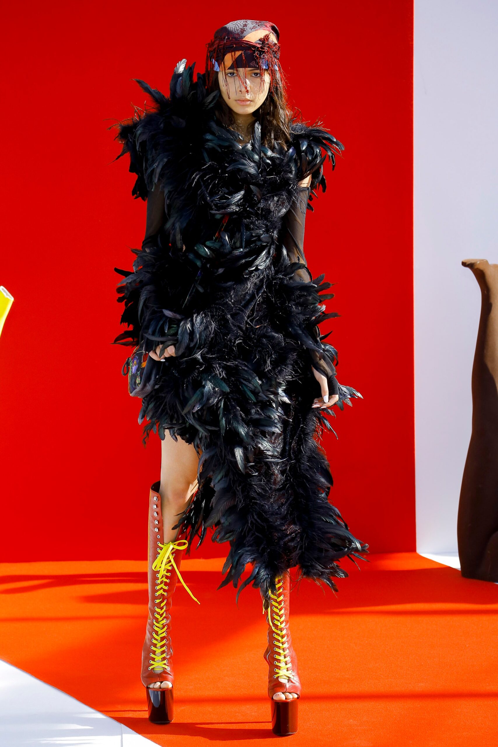 black feather midi dress with red shoes