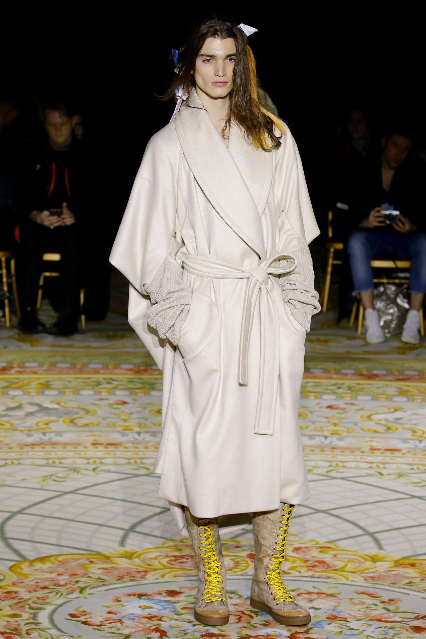 beige relaxed coat with yellow boots