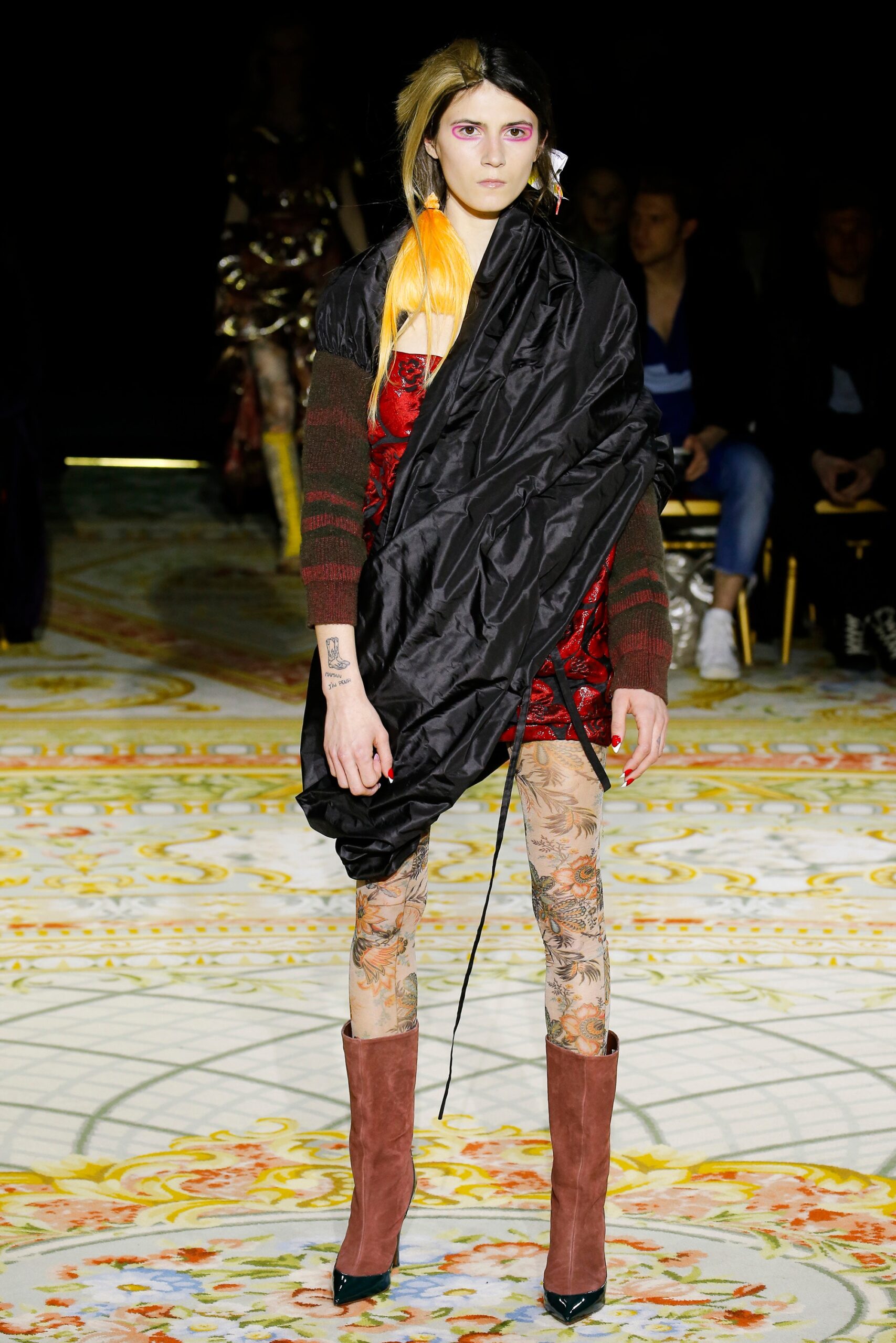 red silk sleeveless dress with black cape