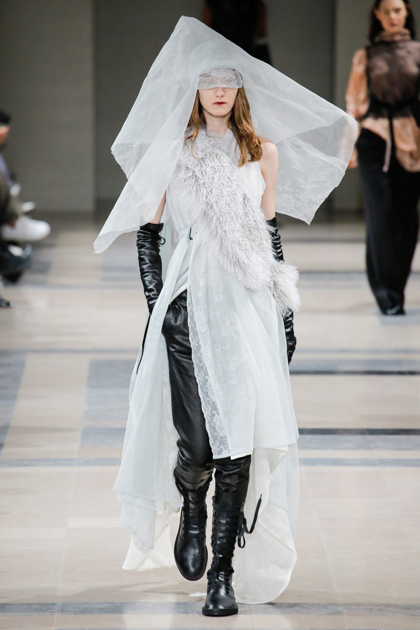 white silk draped dress with black leather pants