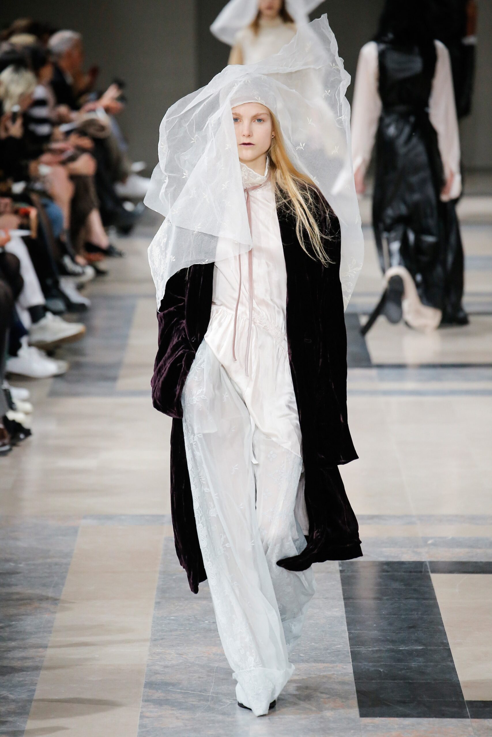 white silk layered dress and purple velvet coat