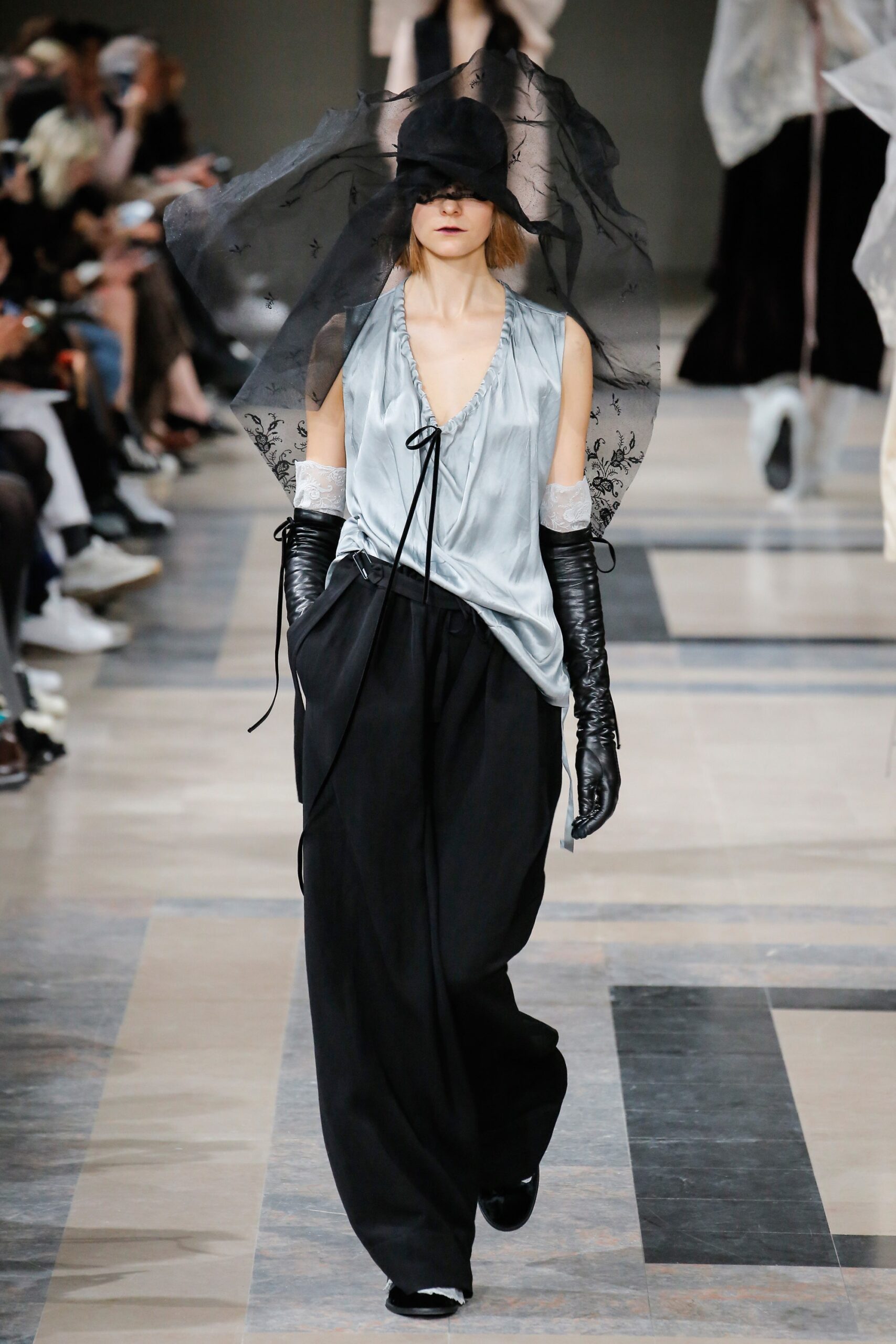 blue silk relaxed top with black pants