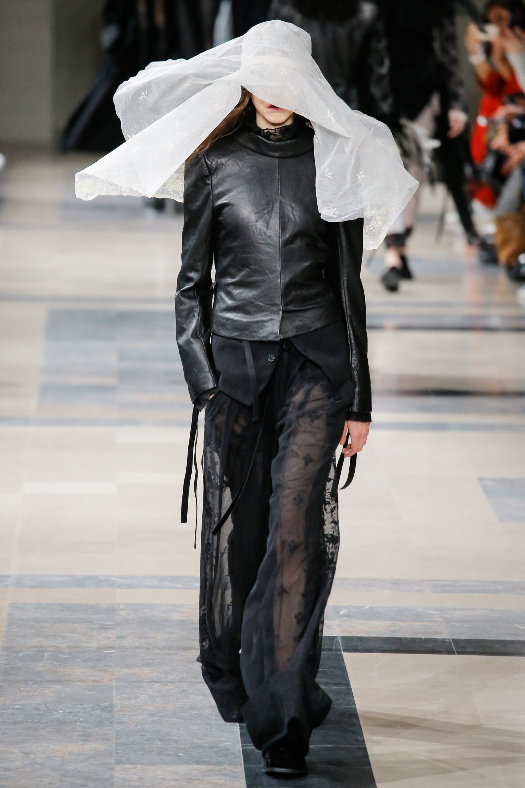 black leather fitted jacket with sheer pants