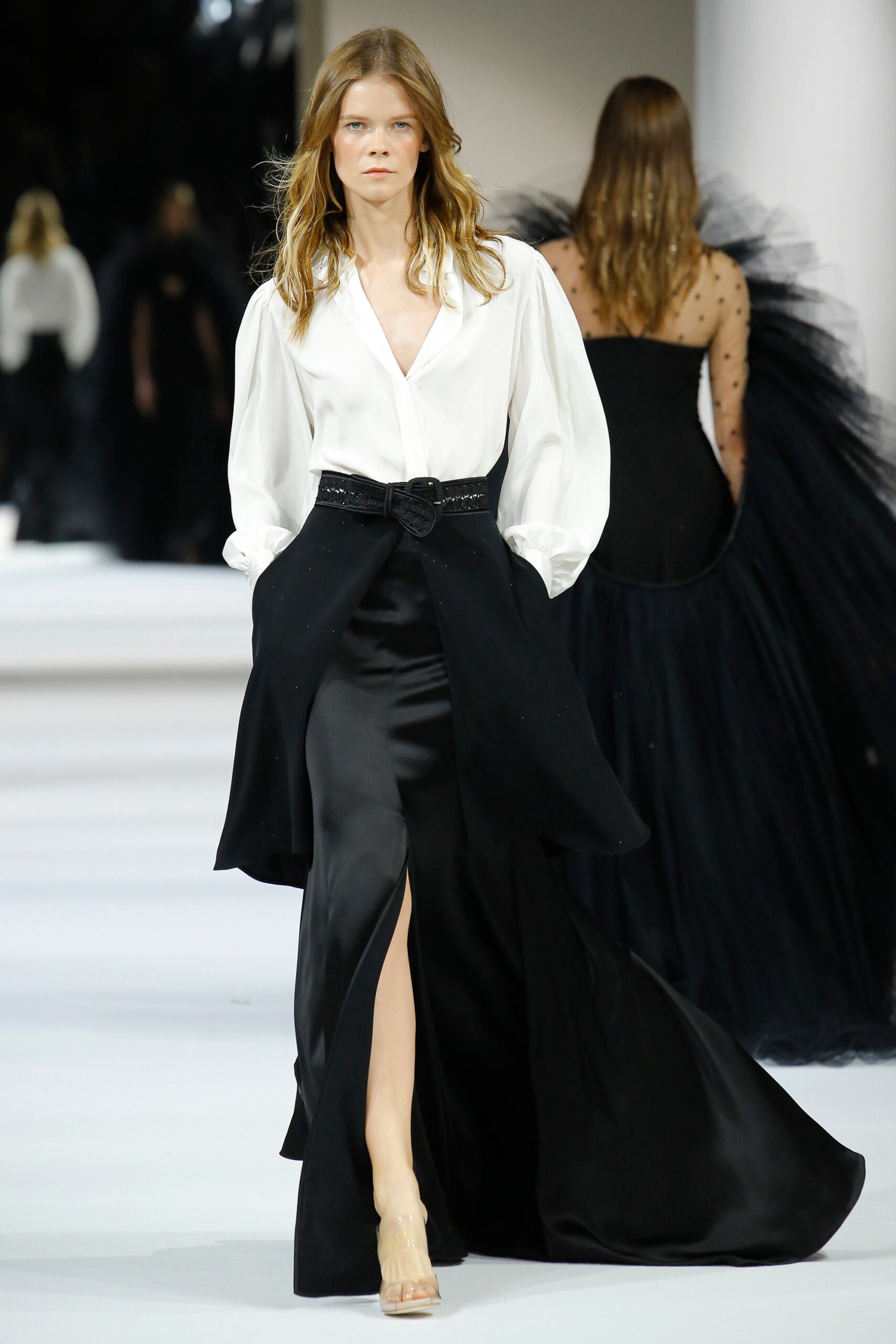 white silk blouse and black skirt