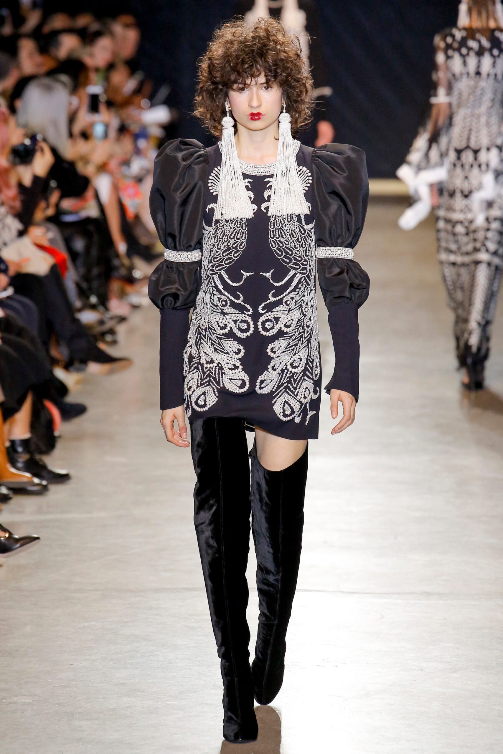 black embroidered mini dress with over-the-knee boots