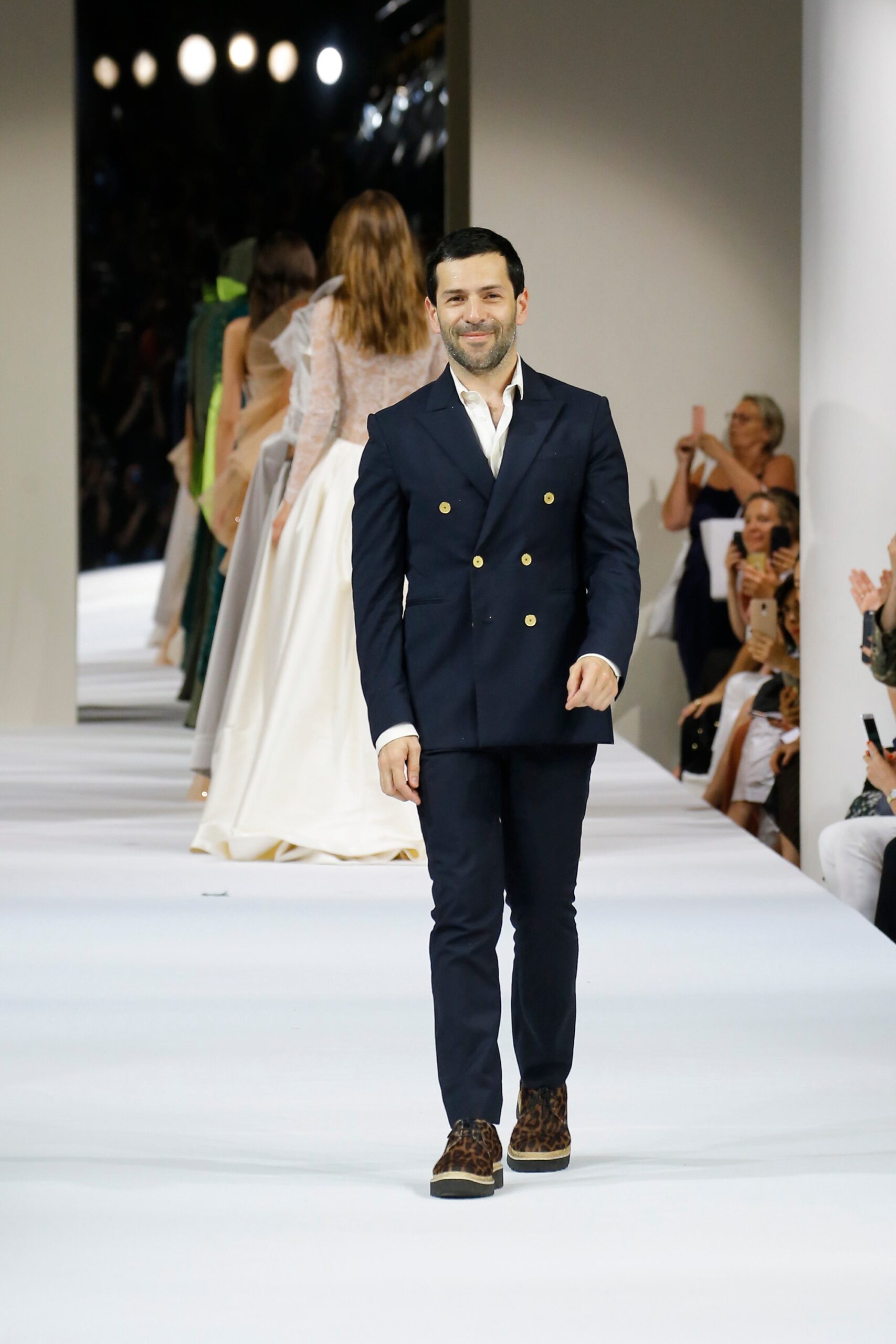 navy tailored suit with animal-print shoes