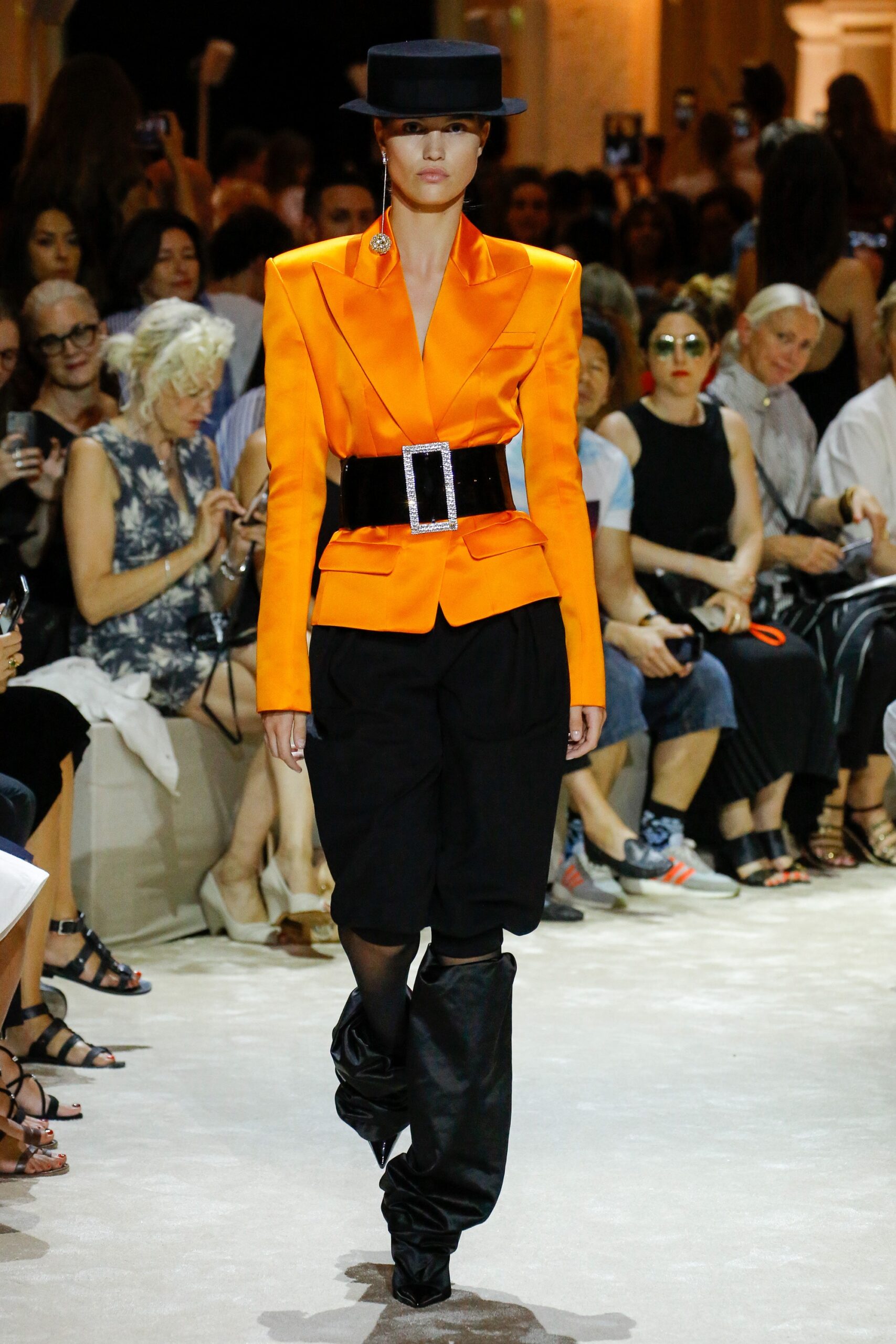 orange structured blazer with black pants