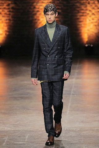 tailored black and gray suit with turtleneck