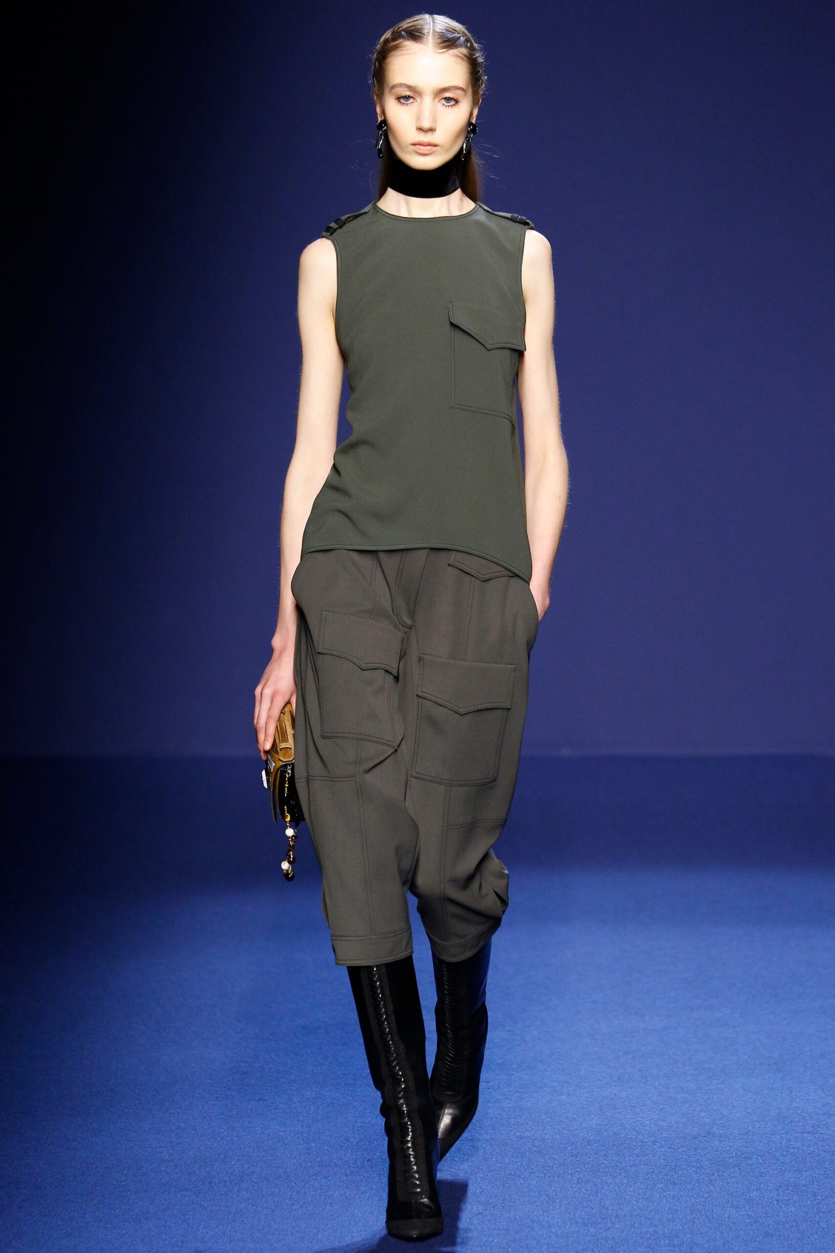 green sleeveless top with cargo pants