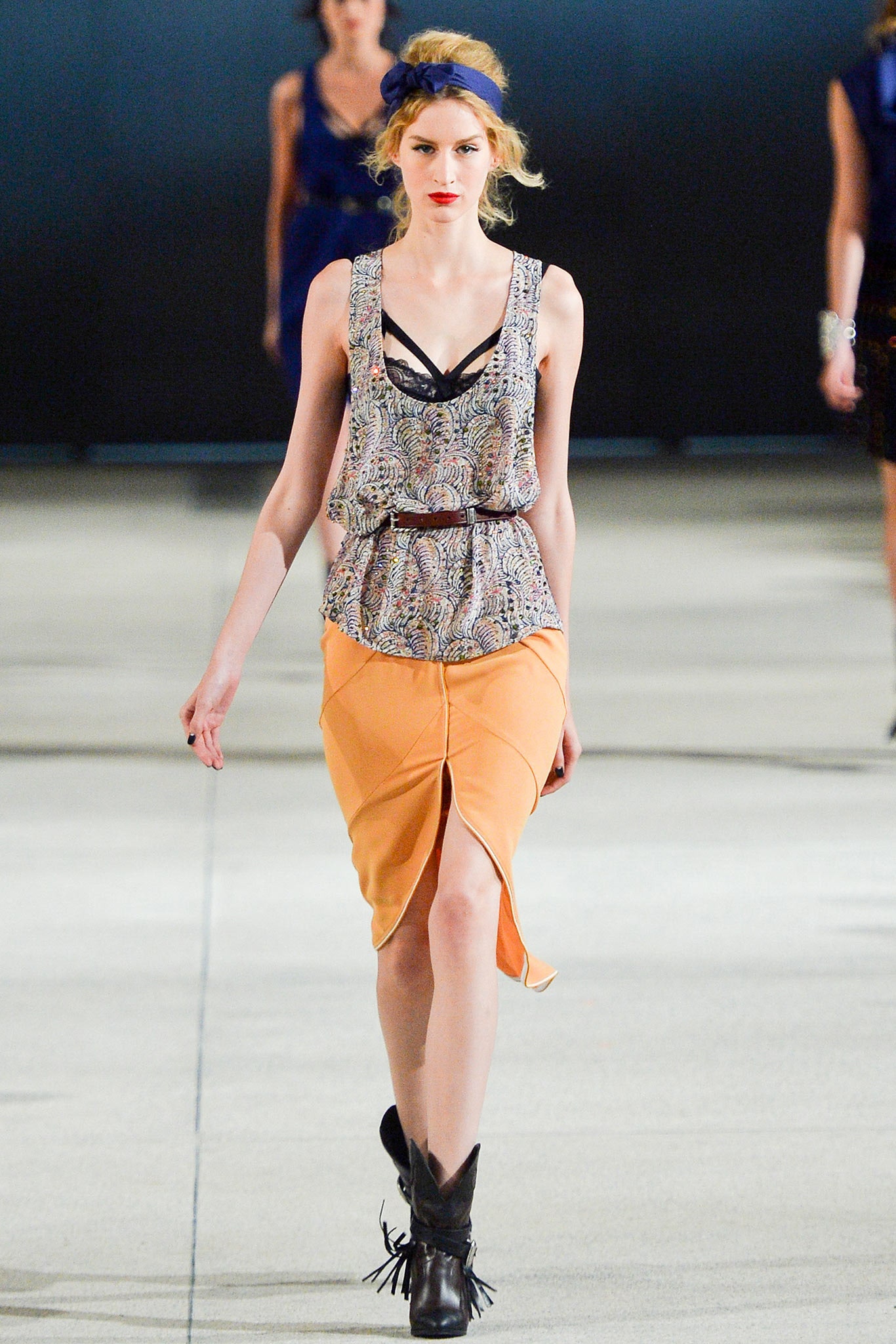 multi-colored sleeveless top with orange skirt