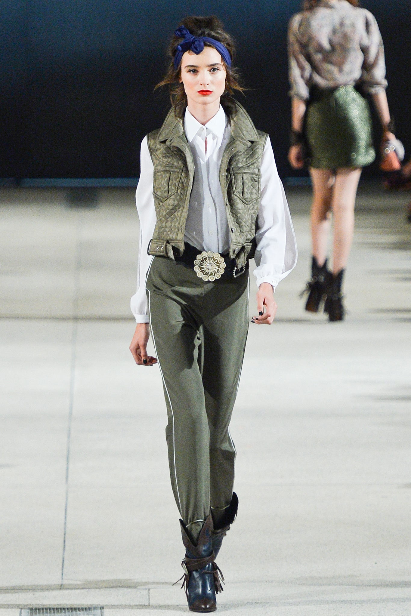 green leather vest with white shirt