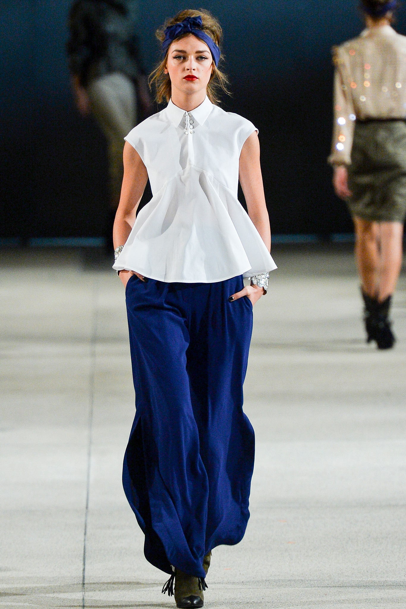 white pleated top with blue pants