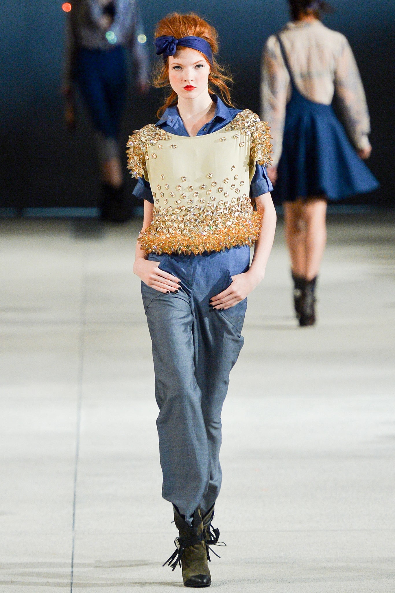 blue beaded top with gray pants