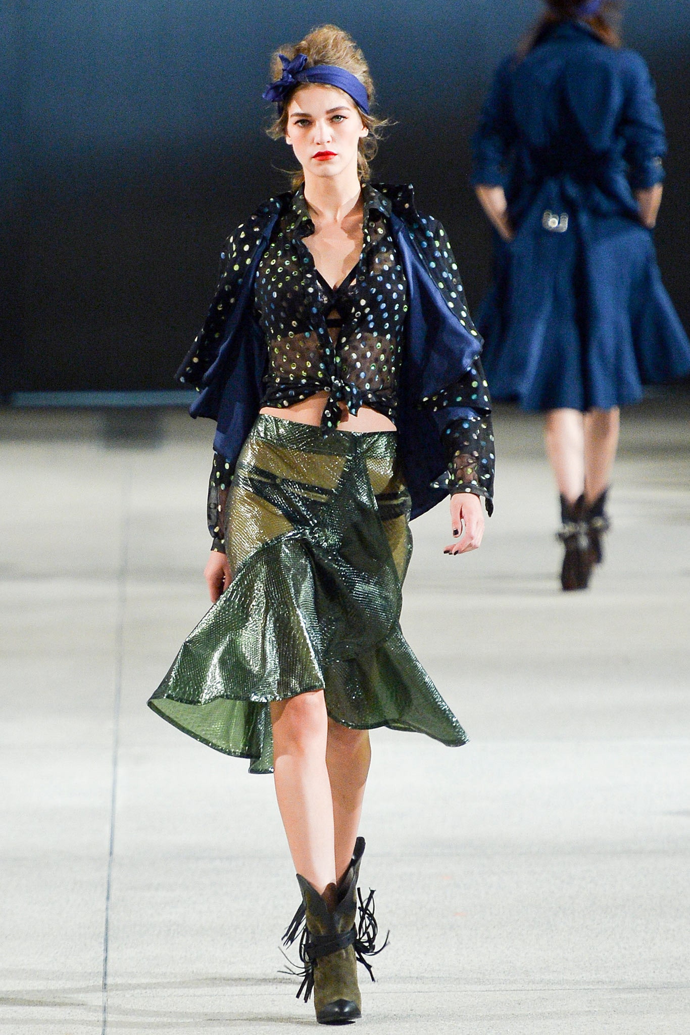 black and white polka-dot blouse with green flared skirt