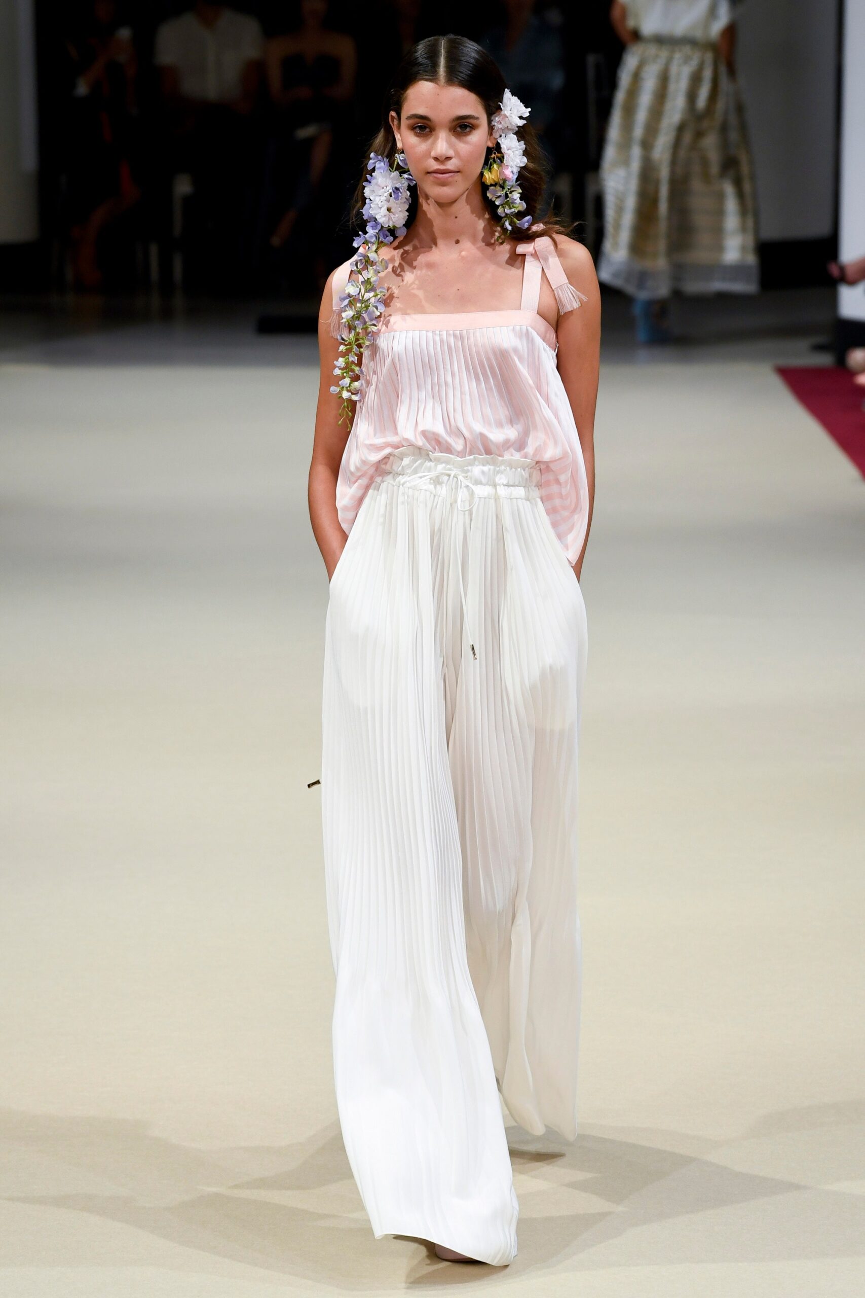 pink silk pleated top and white pants