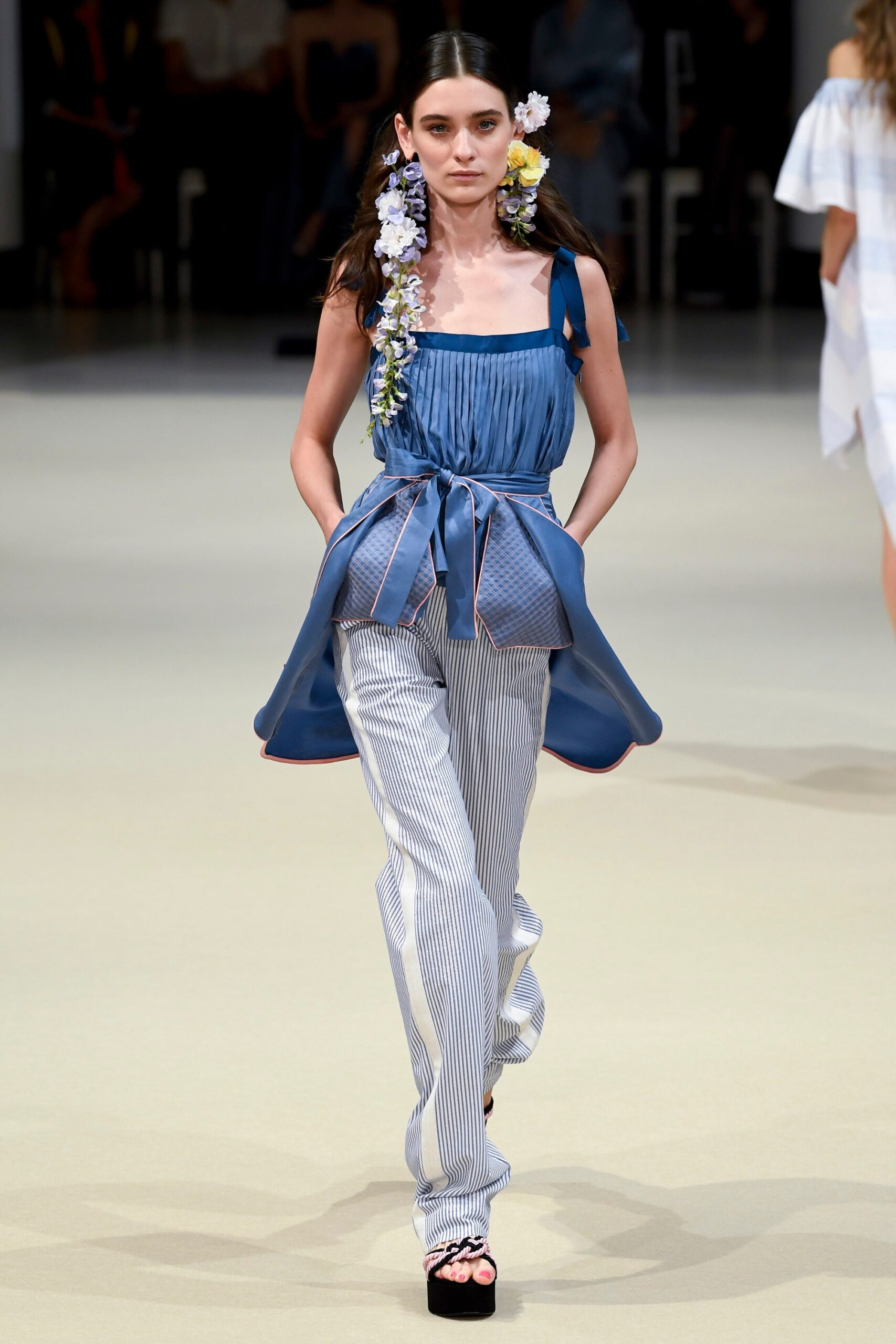 blue silk pleated top with striped pants