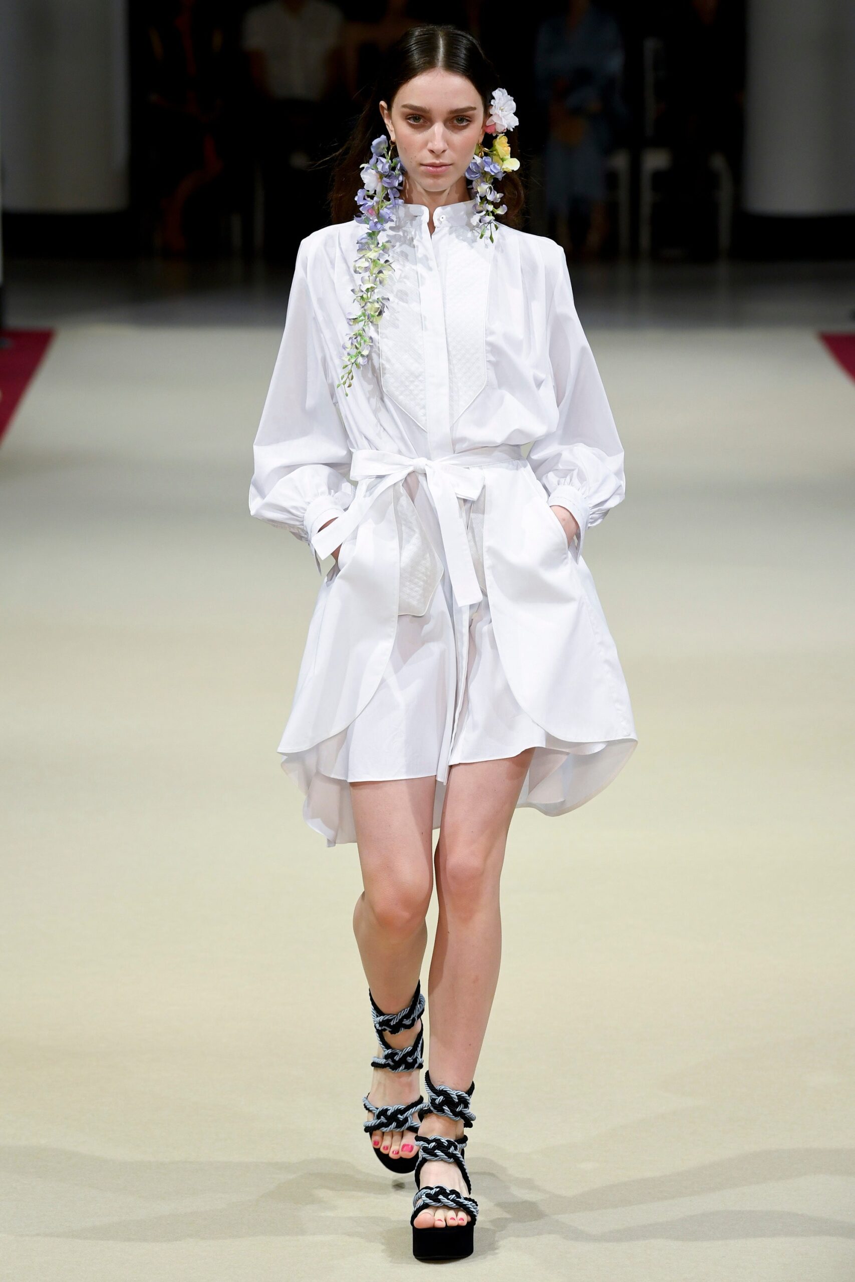 white asymmetric dress with strappy shoes