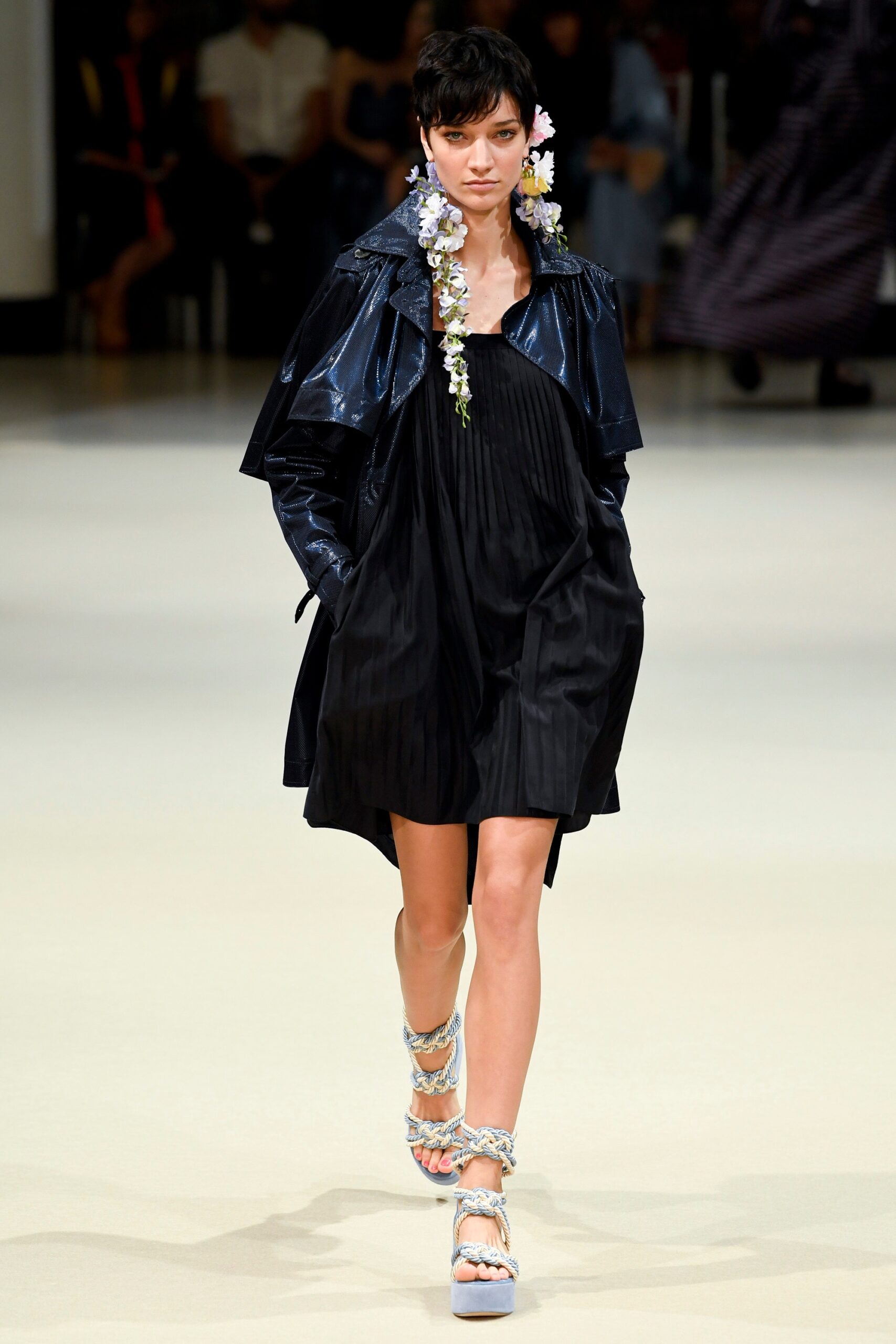 black pleated mini dress with oversized coat