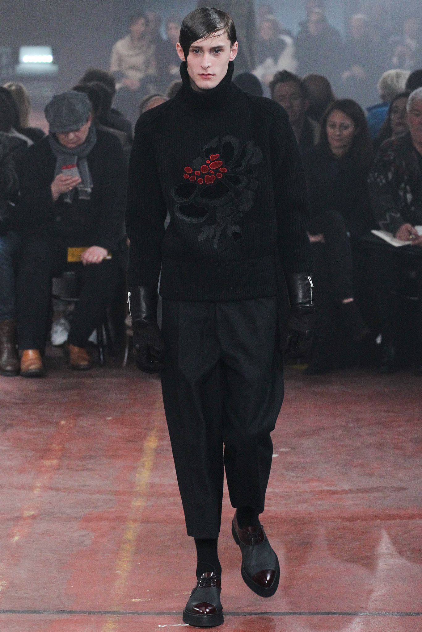 black fitted sweater with pleated pants