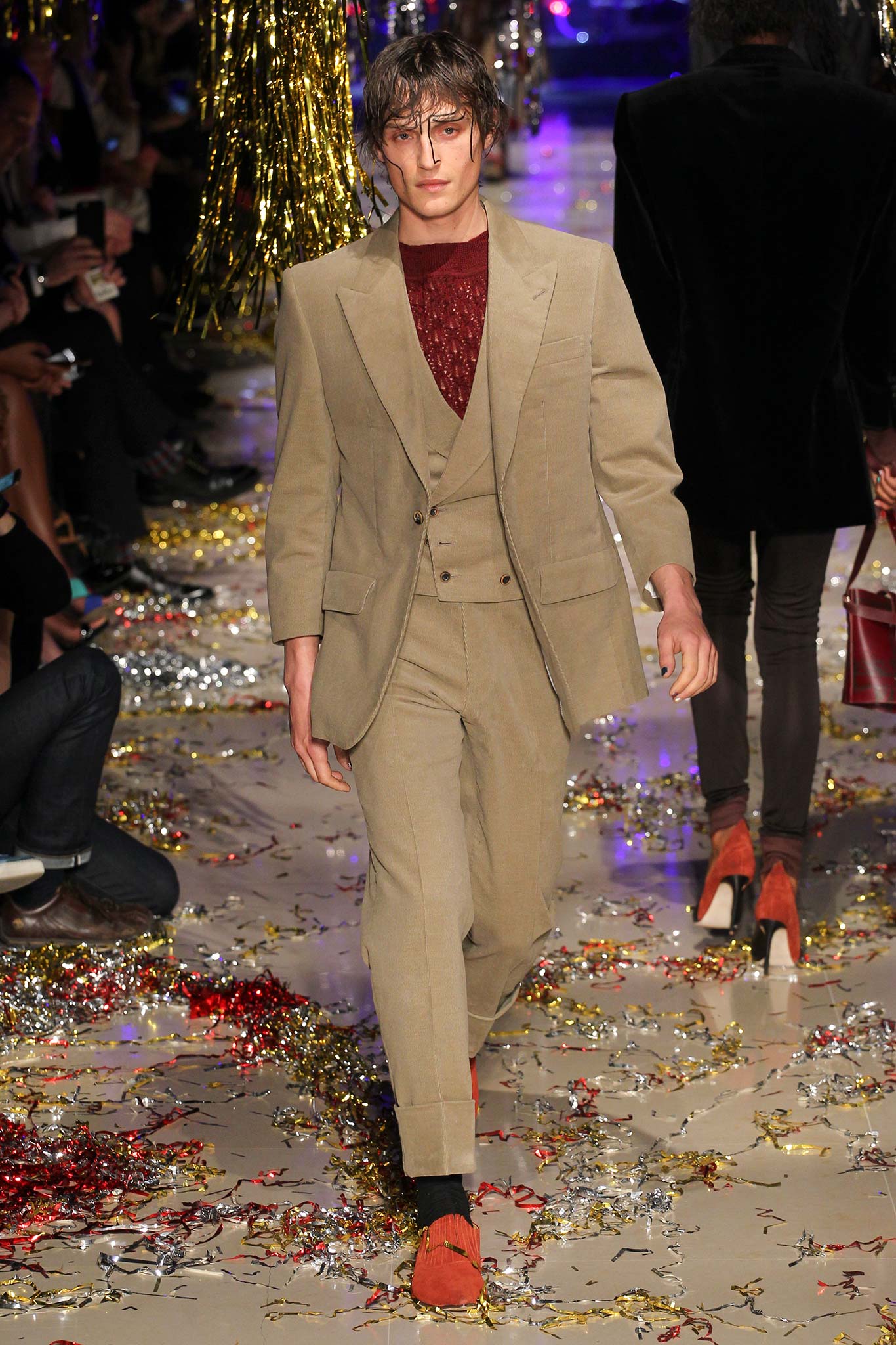 beige tailored suit with red shirt