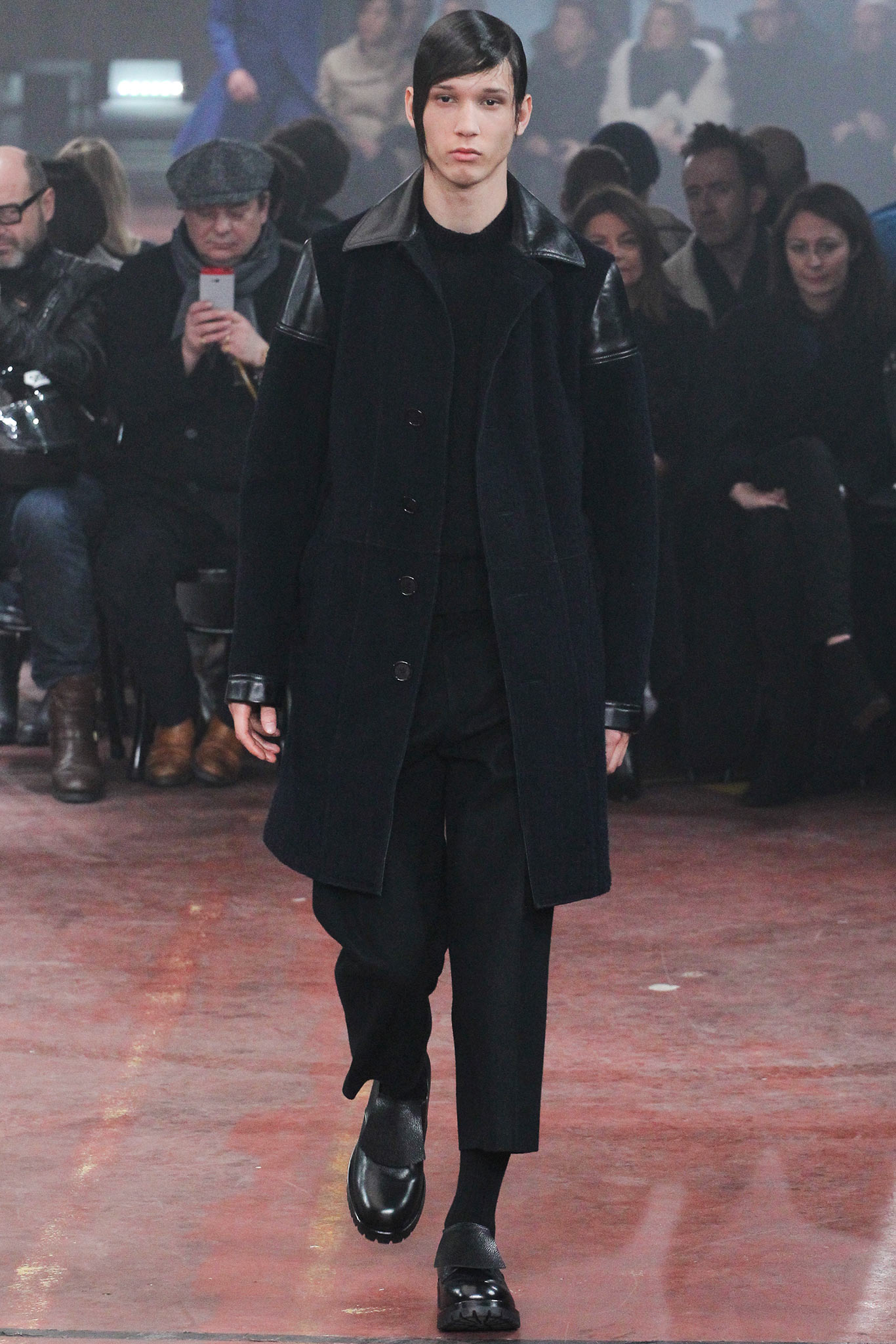 black wool coat with relaxed pants