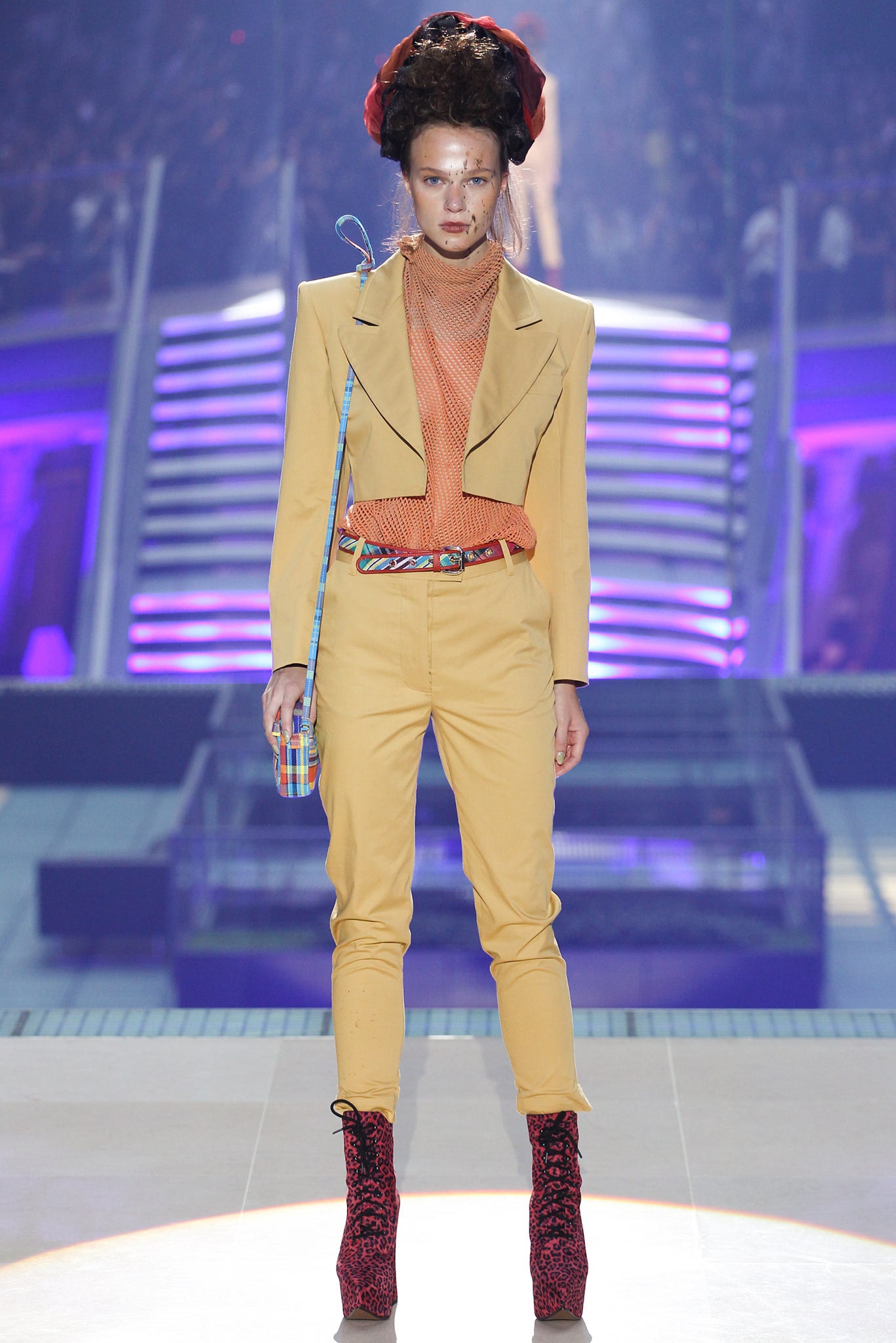 yellow fitted suit with red shoes