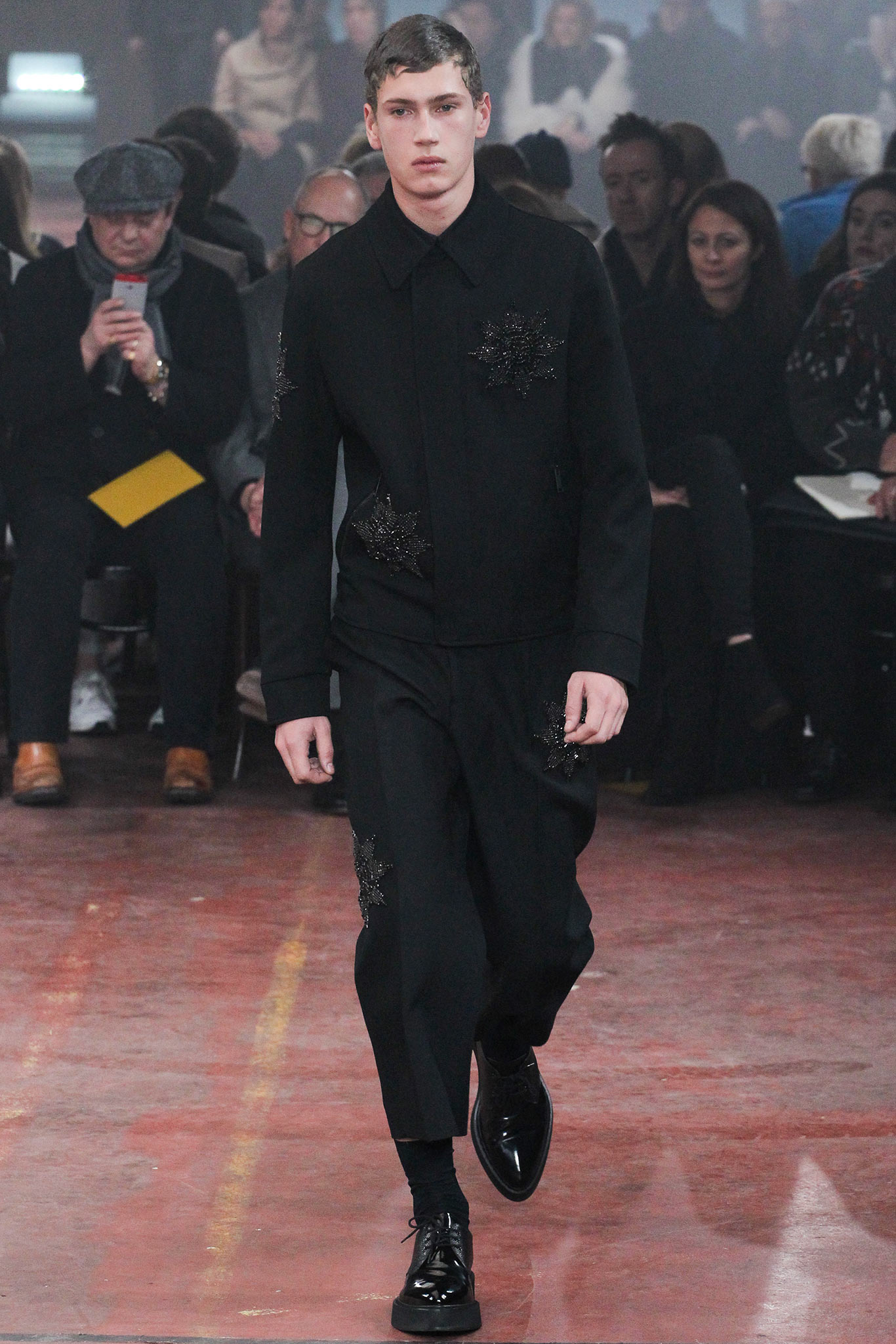 black fitted suit with embroidered details