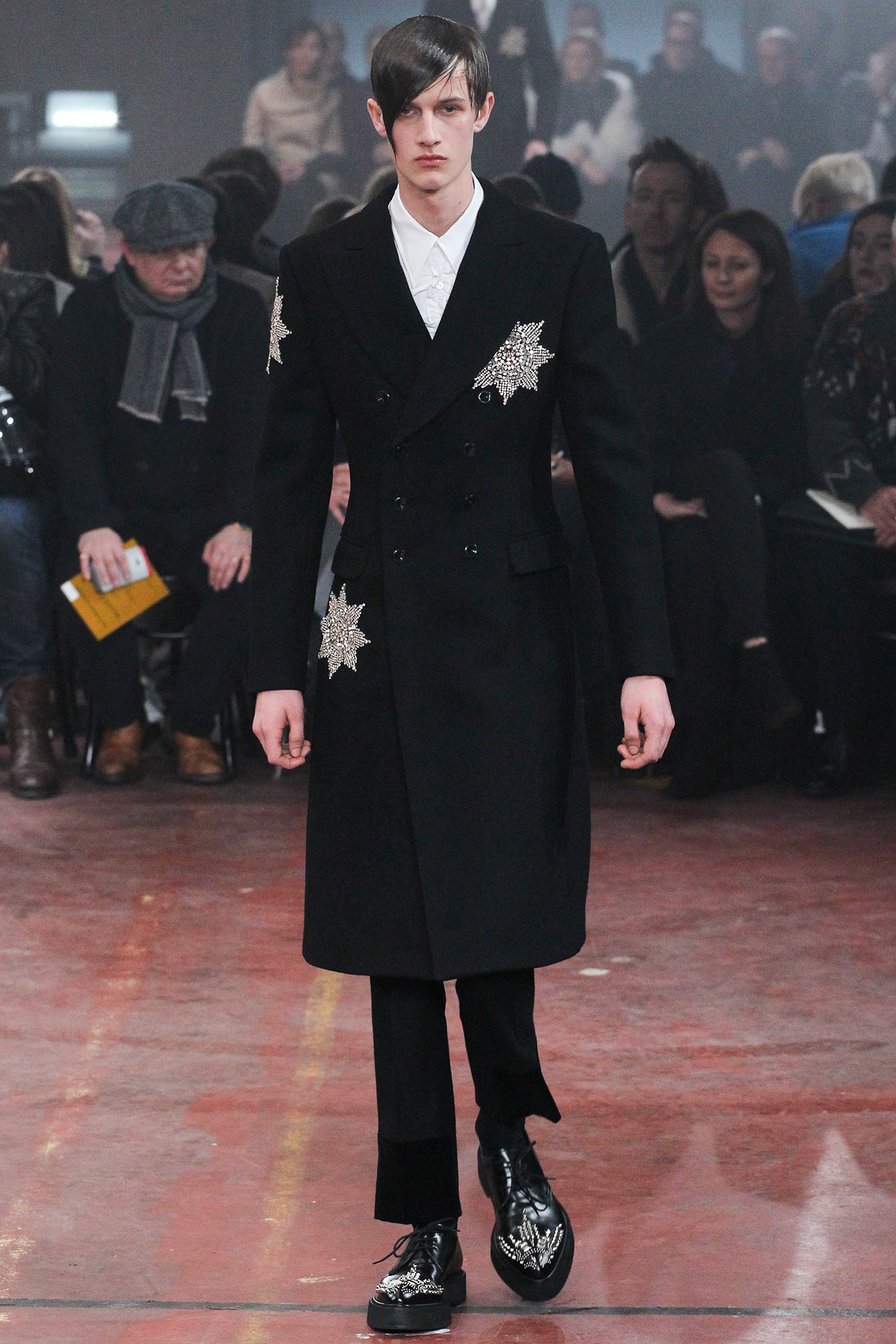 black wool double-breasted coat and tailored pants