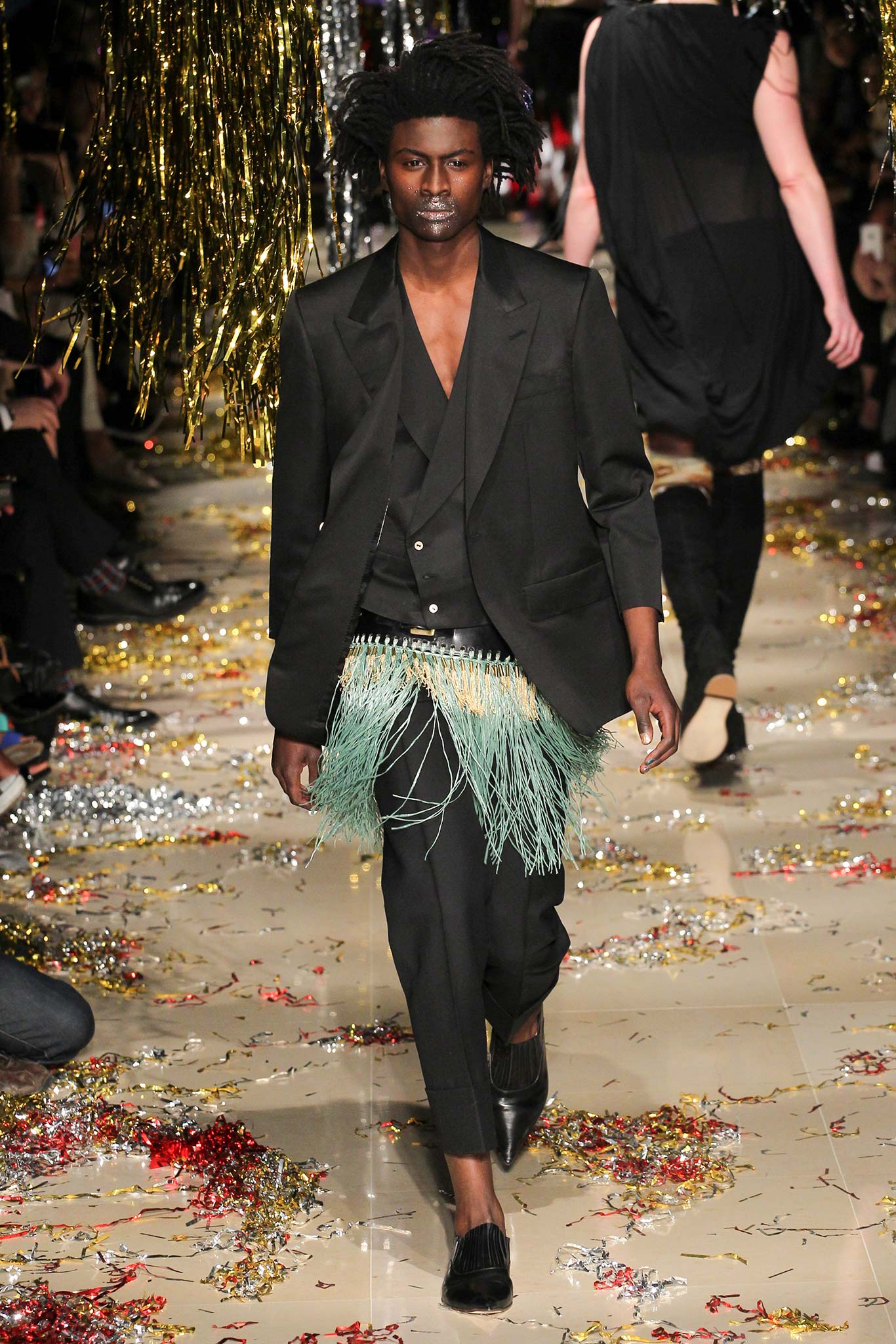 black tailored suit with fringed belt