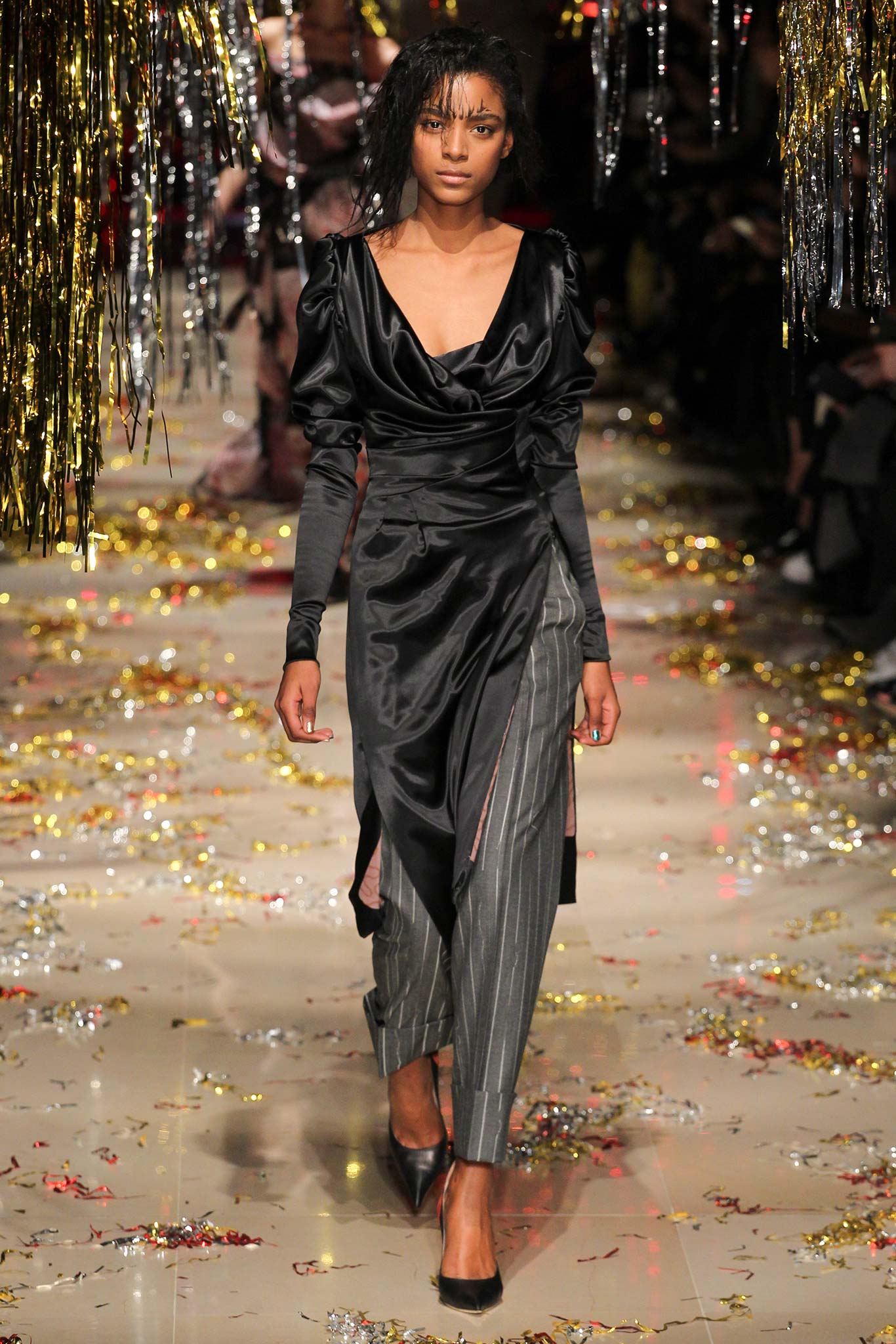 black silk draped dress with gray pants