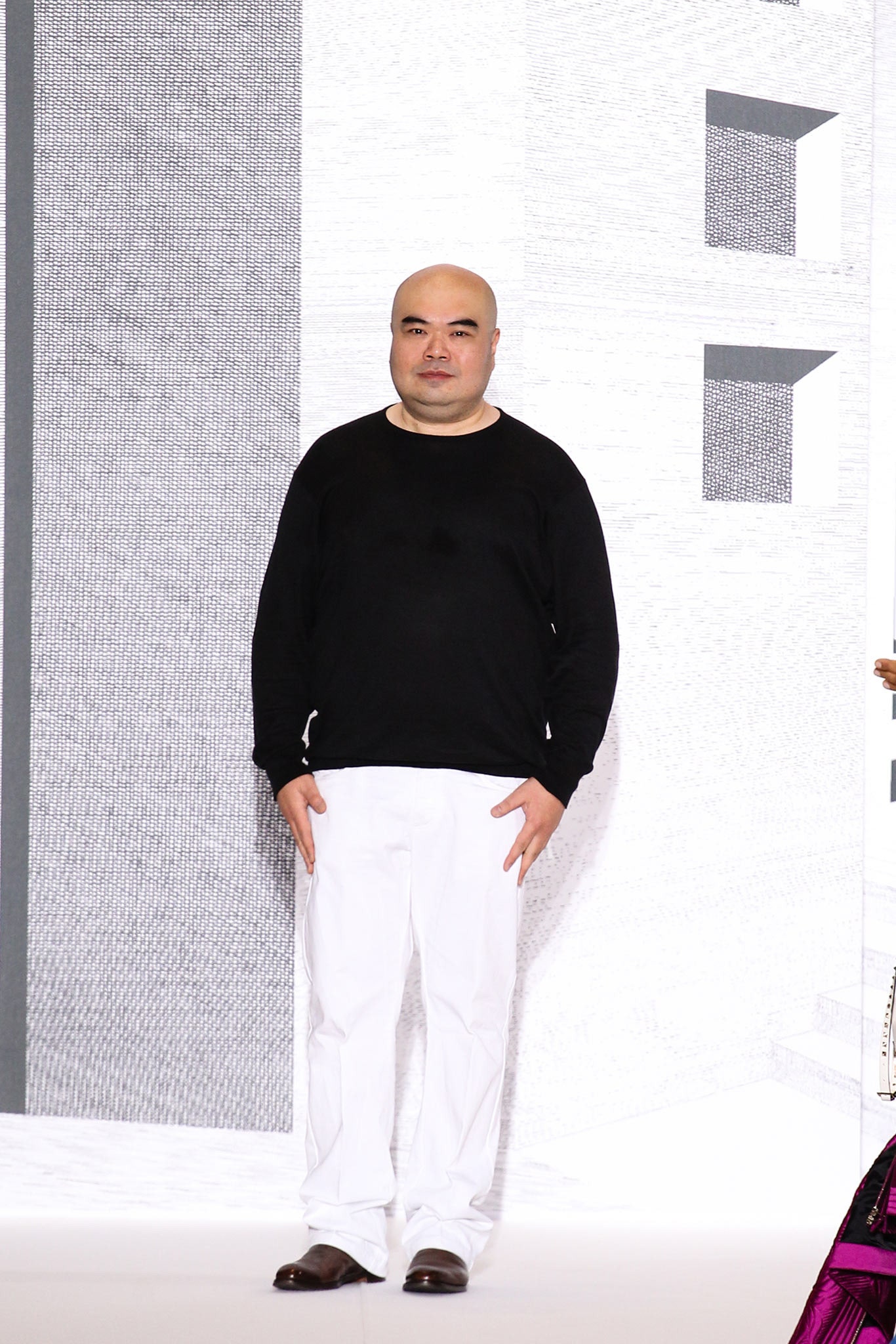 black relaxed sweater and white pants