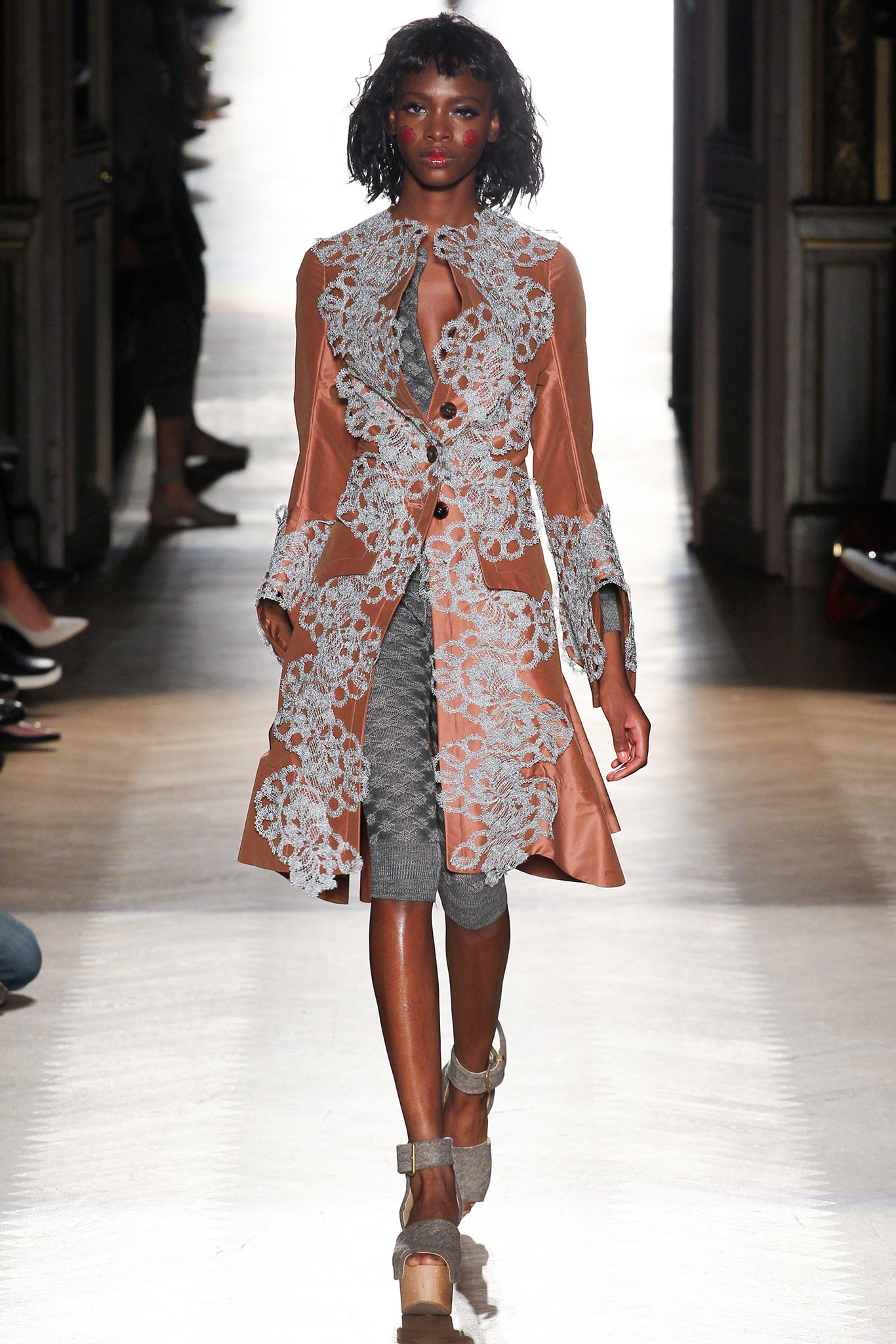 brown embroidered coat with gray dress