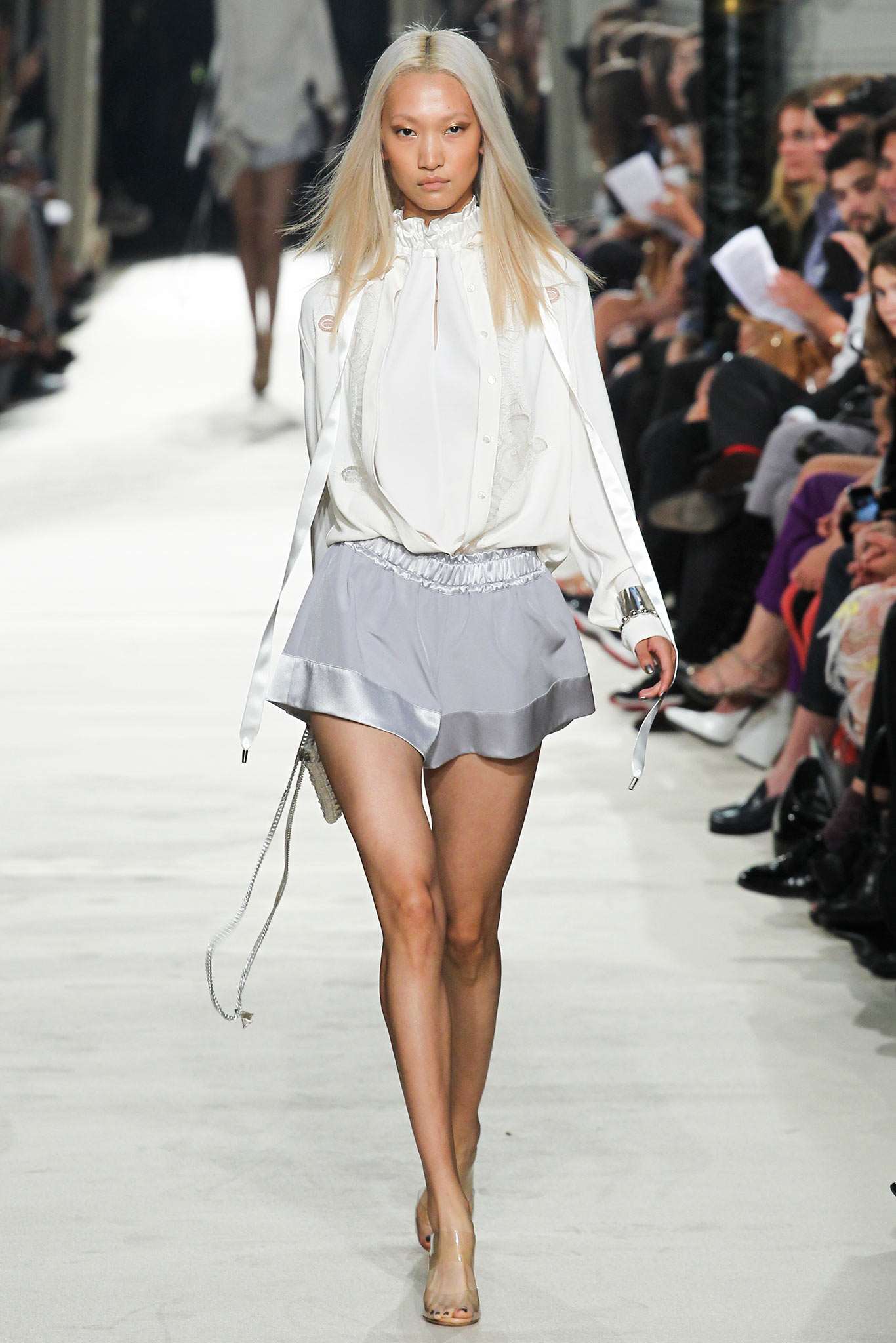 white silk blouse with gray shorts