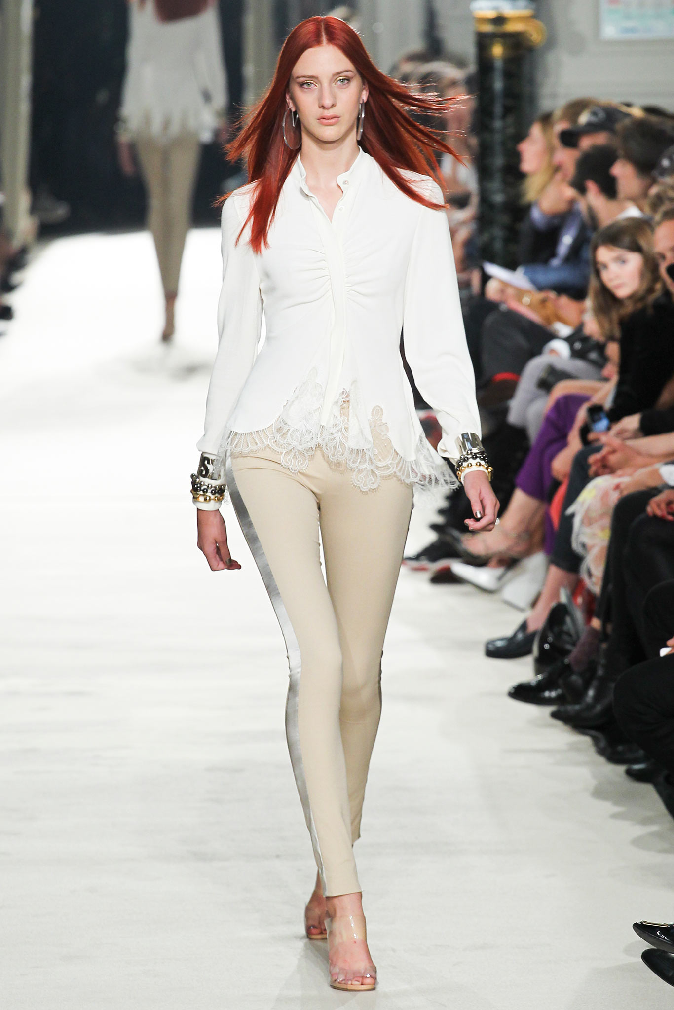 white silk fitted blouse with beige pants