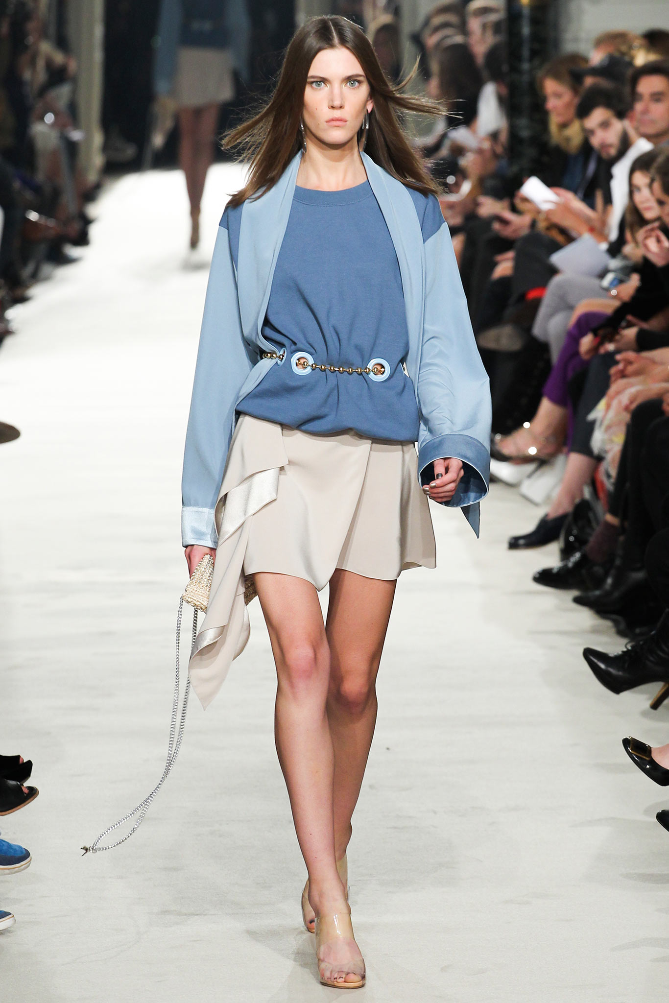 blue fitted top with beige asymmetric skirt
