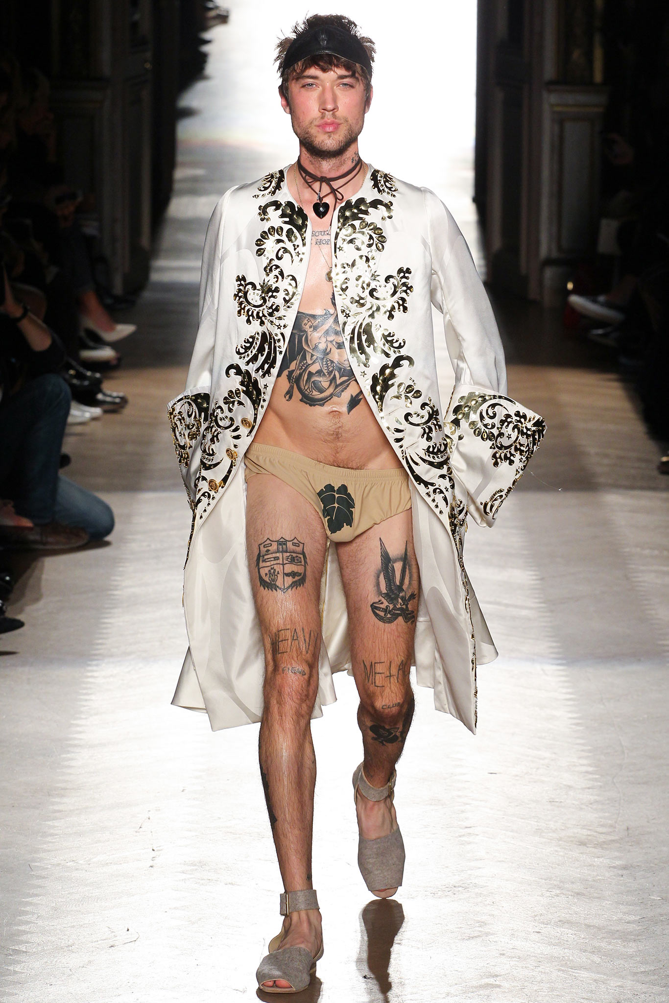 embroidered white coat with beige shorts