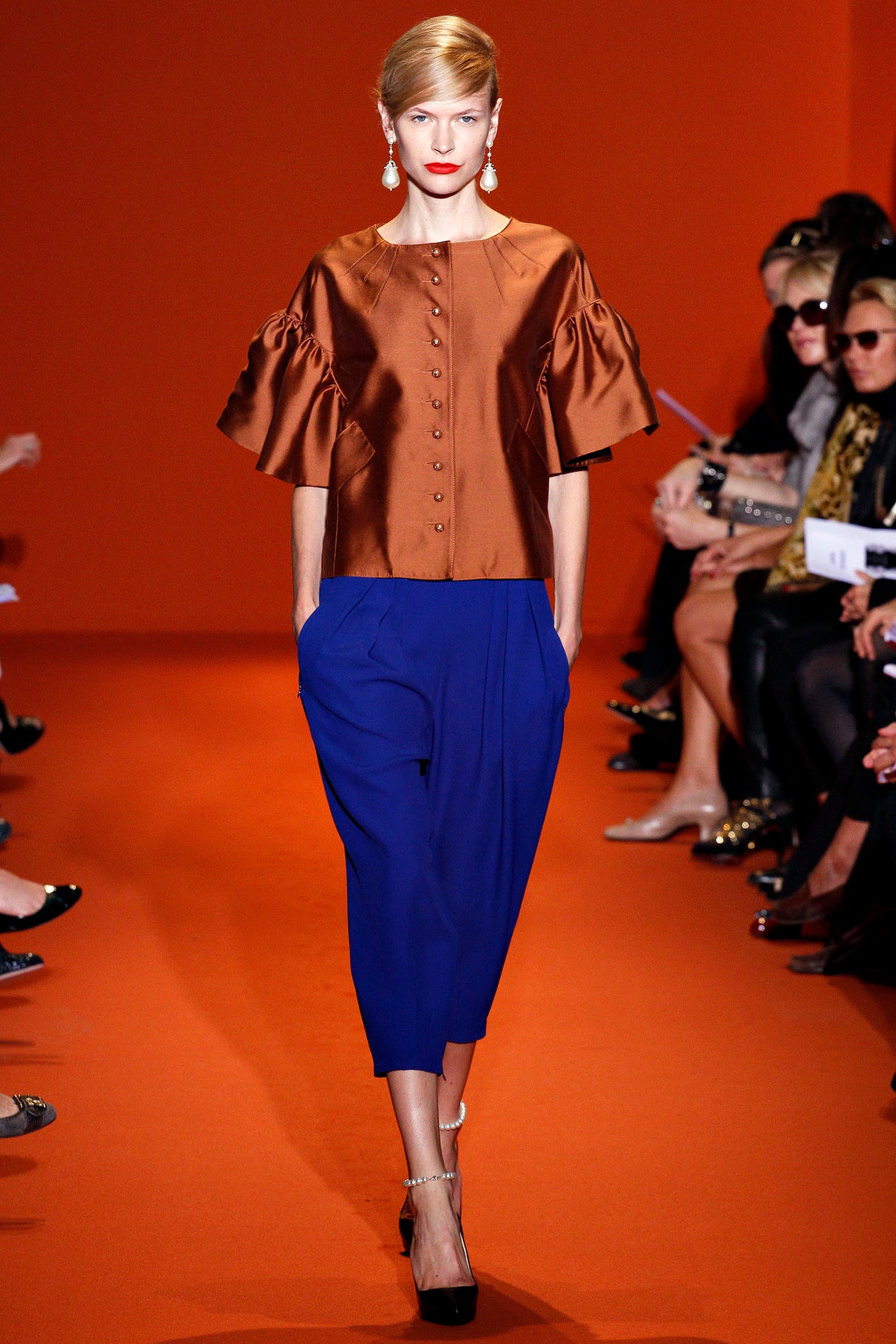brown silk top with blue pants