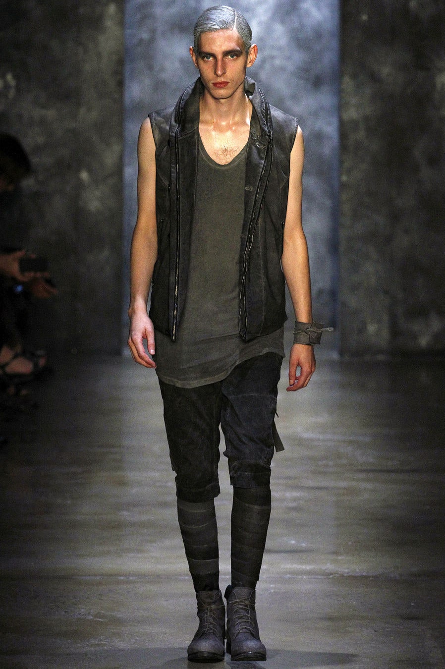 black leather vest and fitted pants