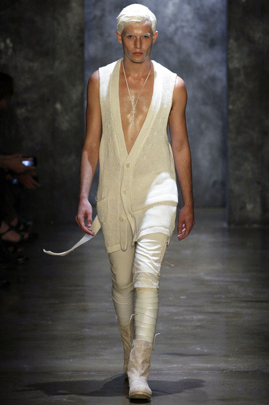 white knit vest with beige pants