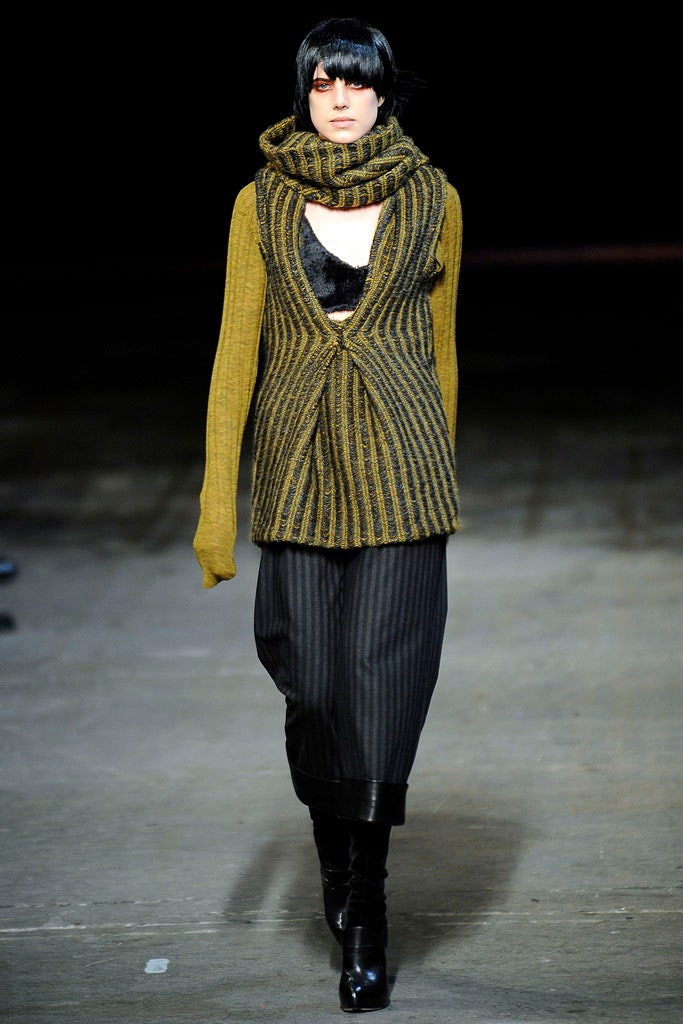 yellow striped top with black pants