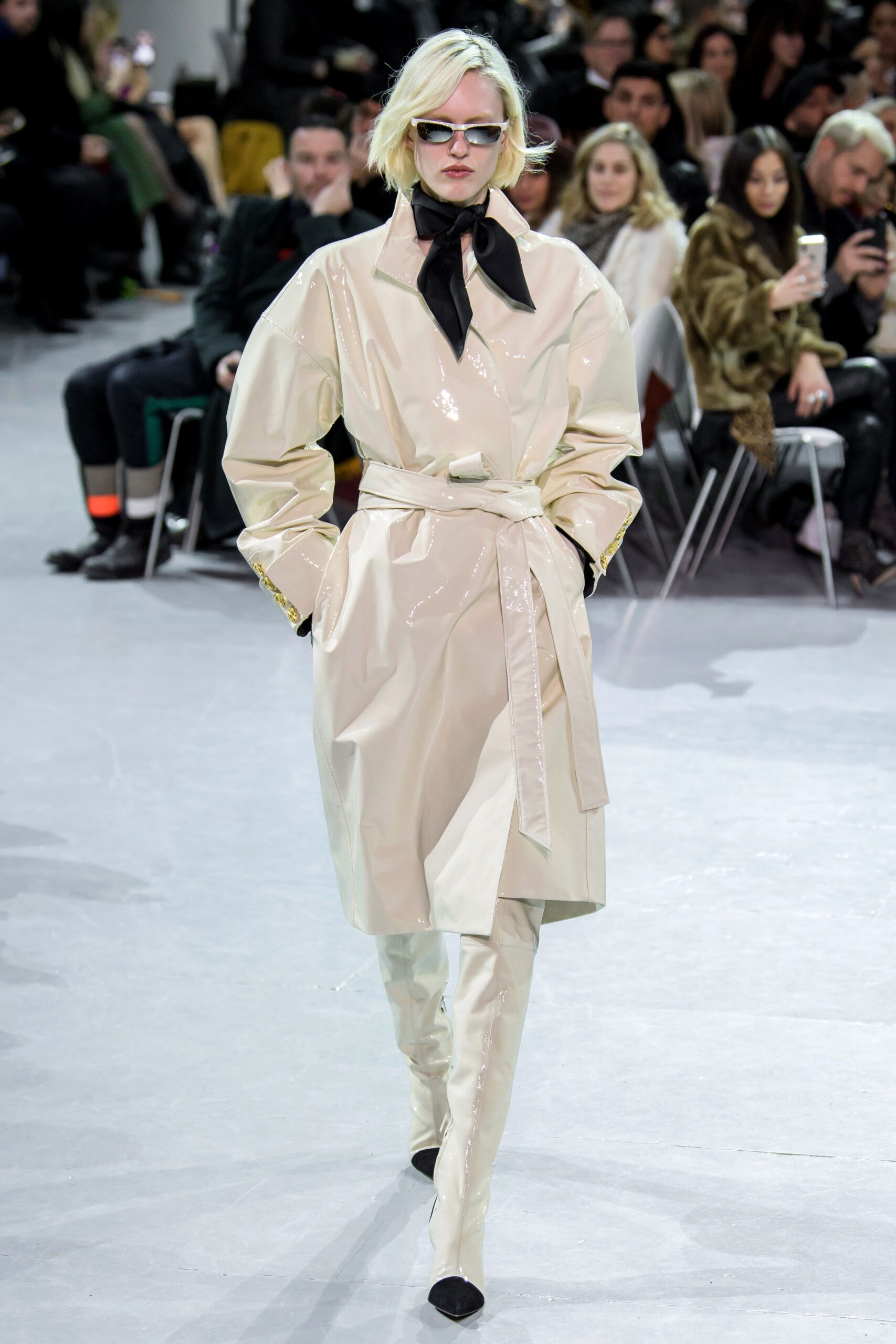 beige vinyl long-sleeve collared fitted belted zippered coat