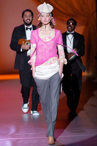 pink silk fitted top with gray pants