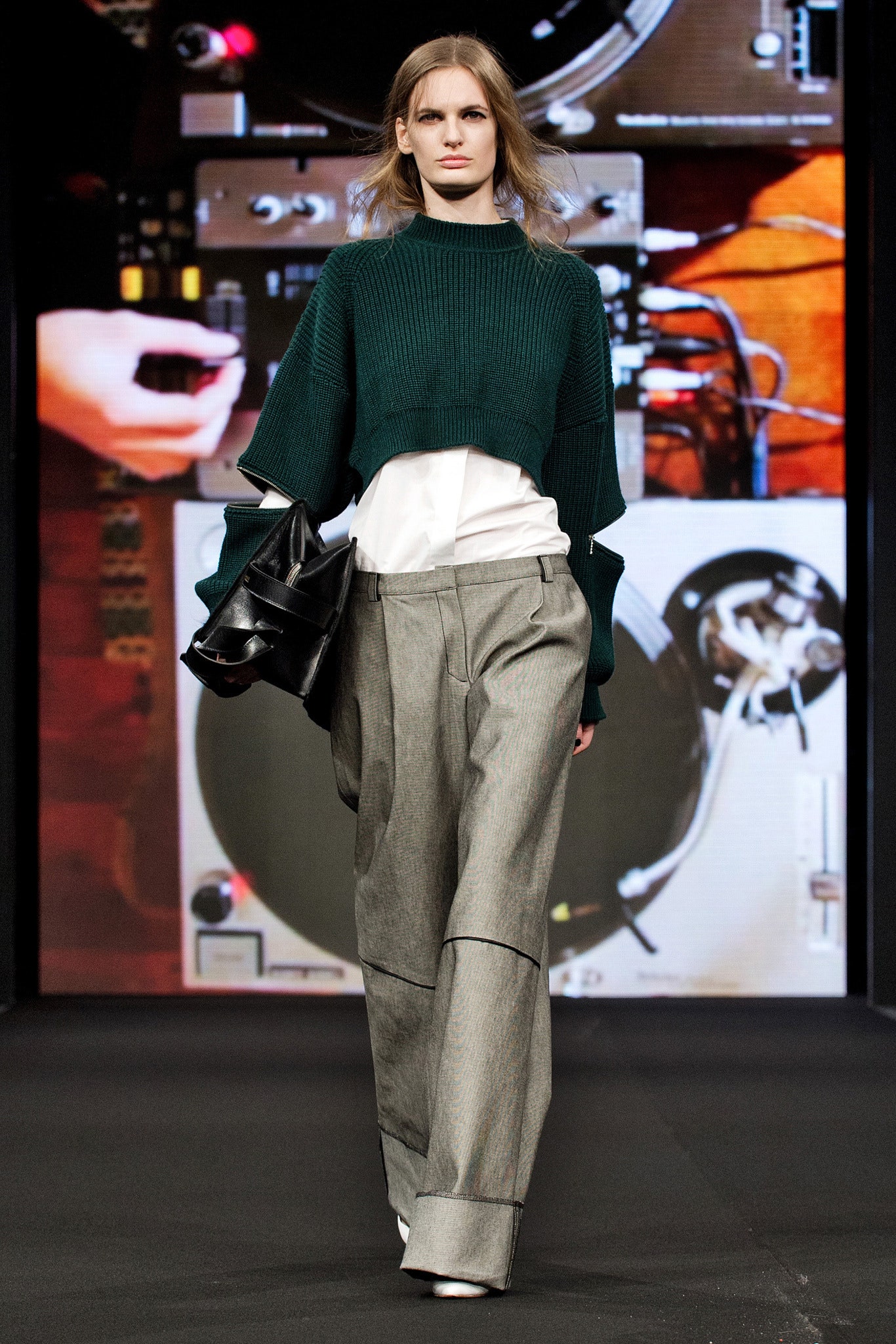 oversized green knit top with gray pants
