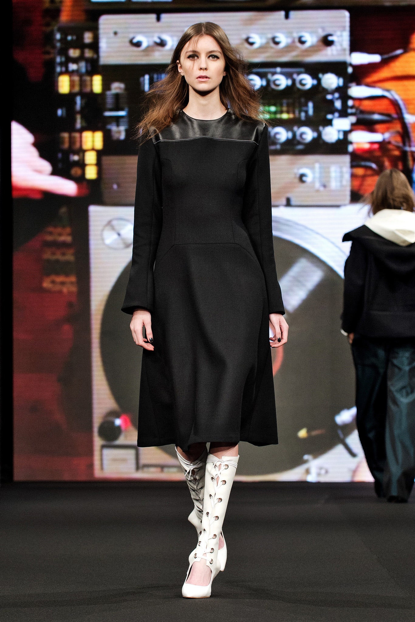 black fitted midi dress with white boots