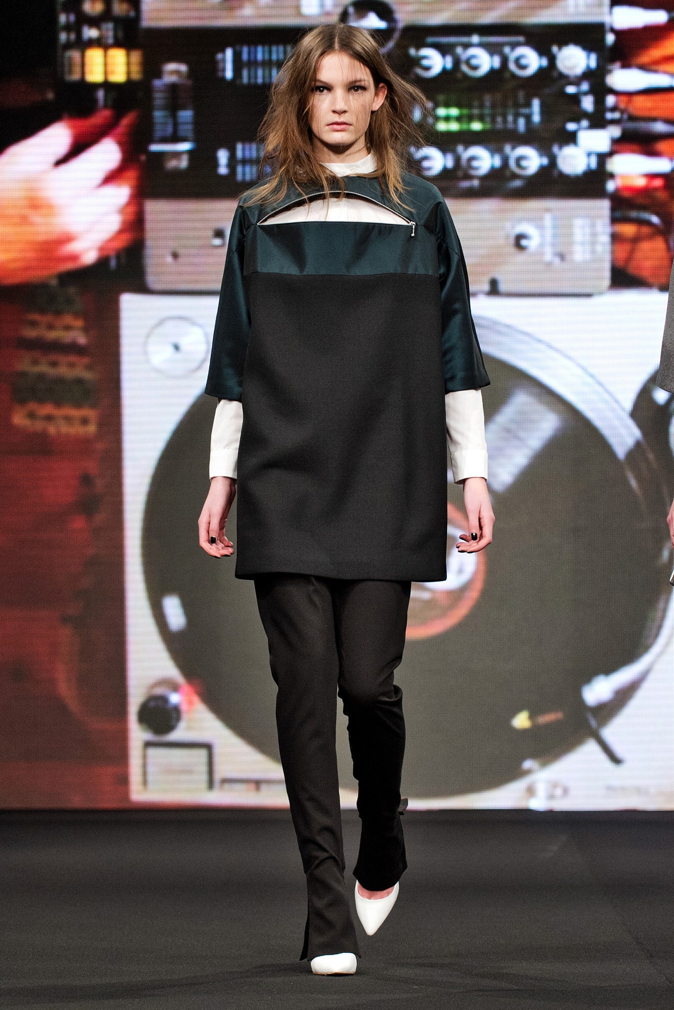 black and green relaxed top with slim pants