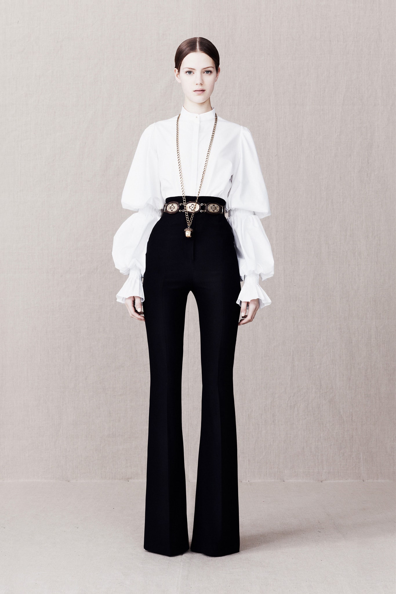 white cotton long-sleeve high-neck fitted ruffled blouse