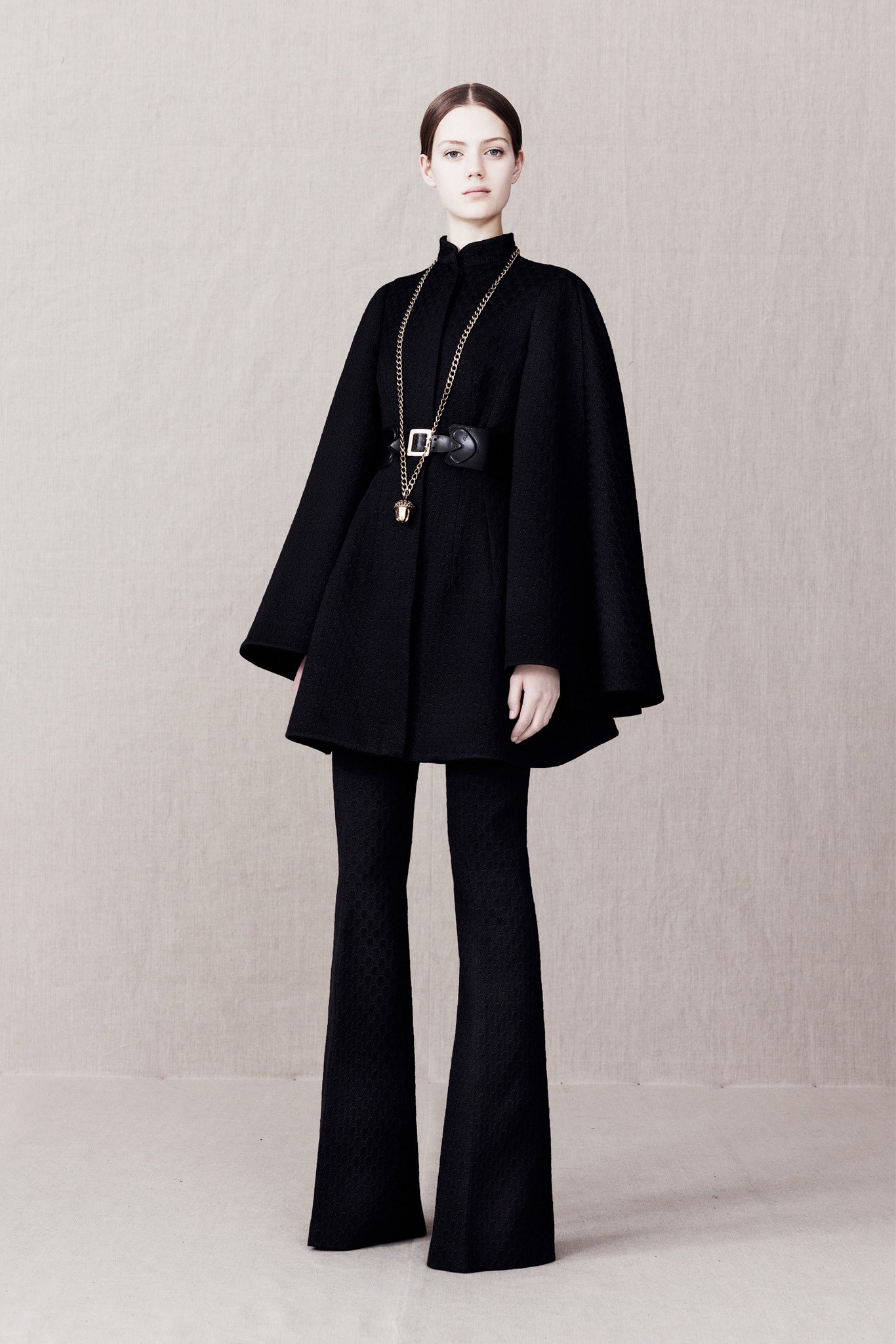 black wool long-sleeve collared structured belted cape